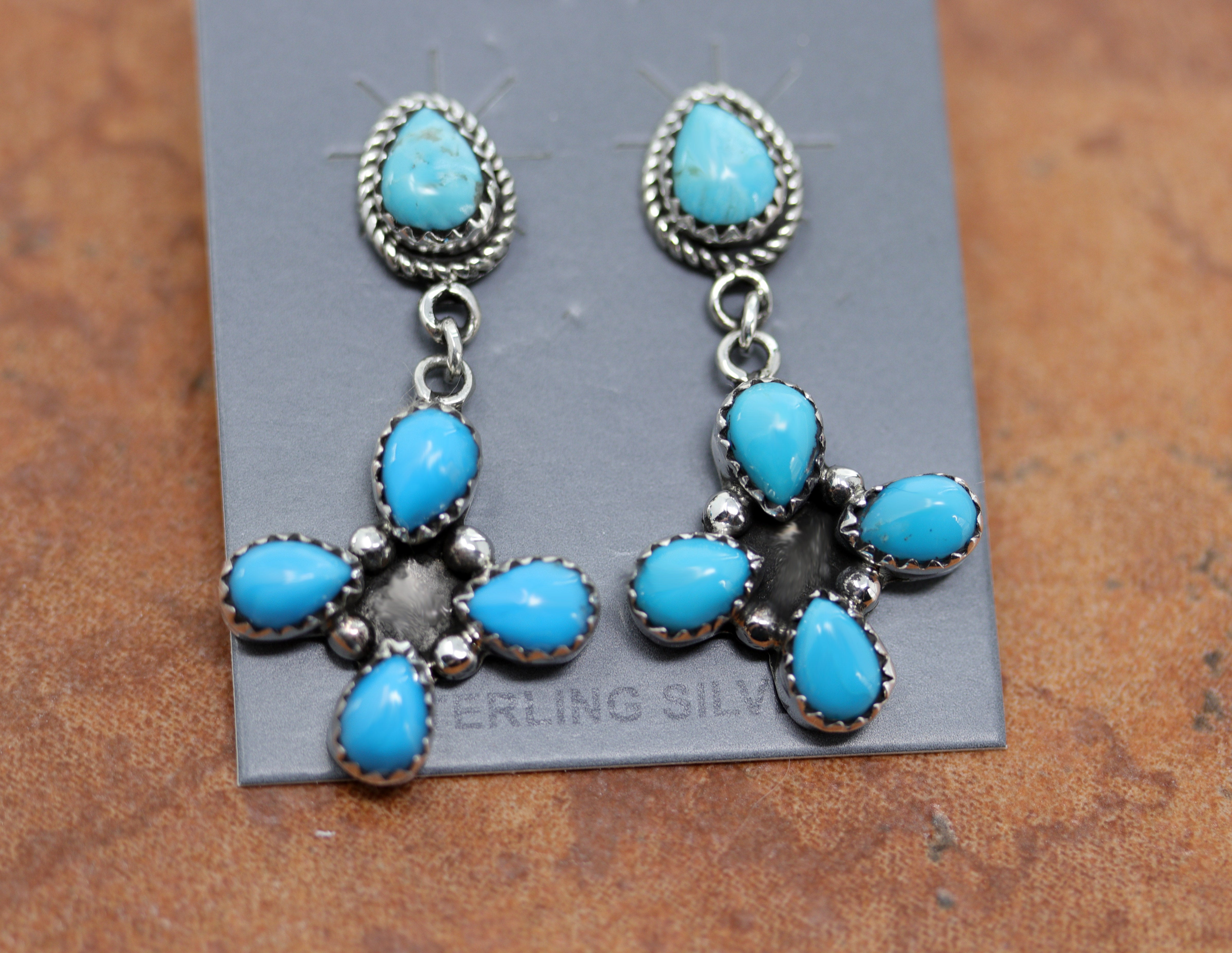 Navajo Native American post earrings. They are made from sterling silver and turquoise. The earrings are about 1 5/8" in length and 7/8" wide.