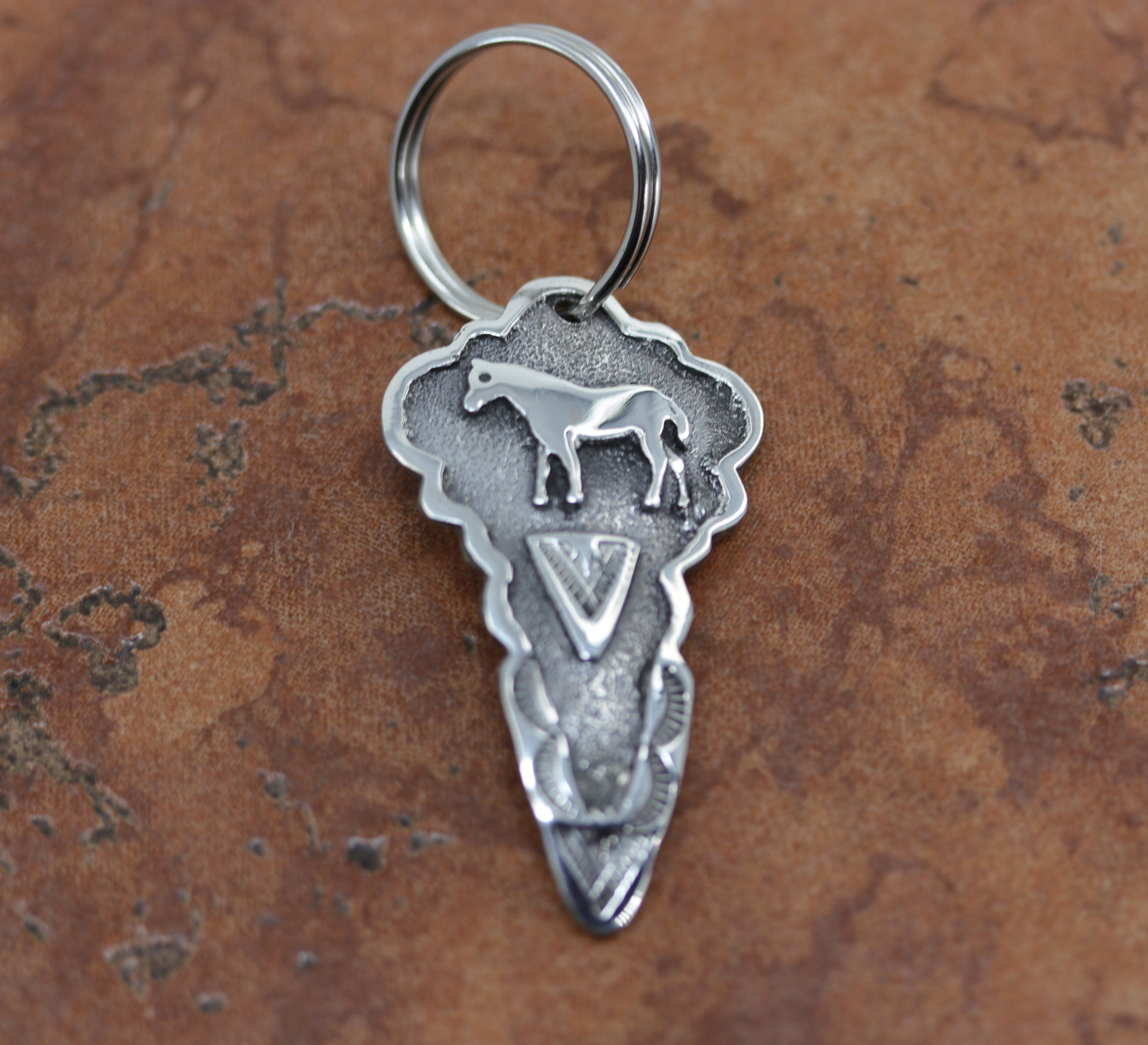 Beautiful Navajo Native American horse key chain. It is made from sterling silver. The key chain is about 3" in length and 1 1/4".