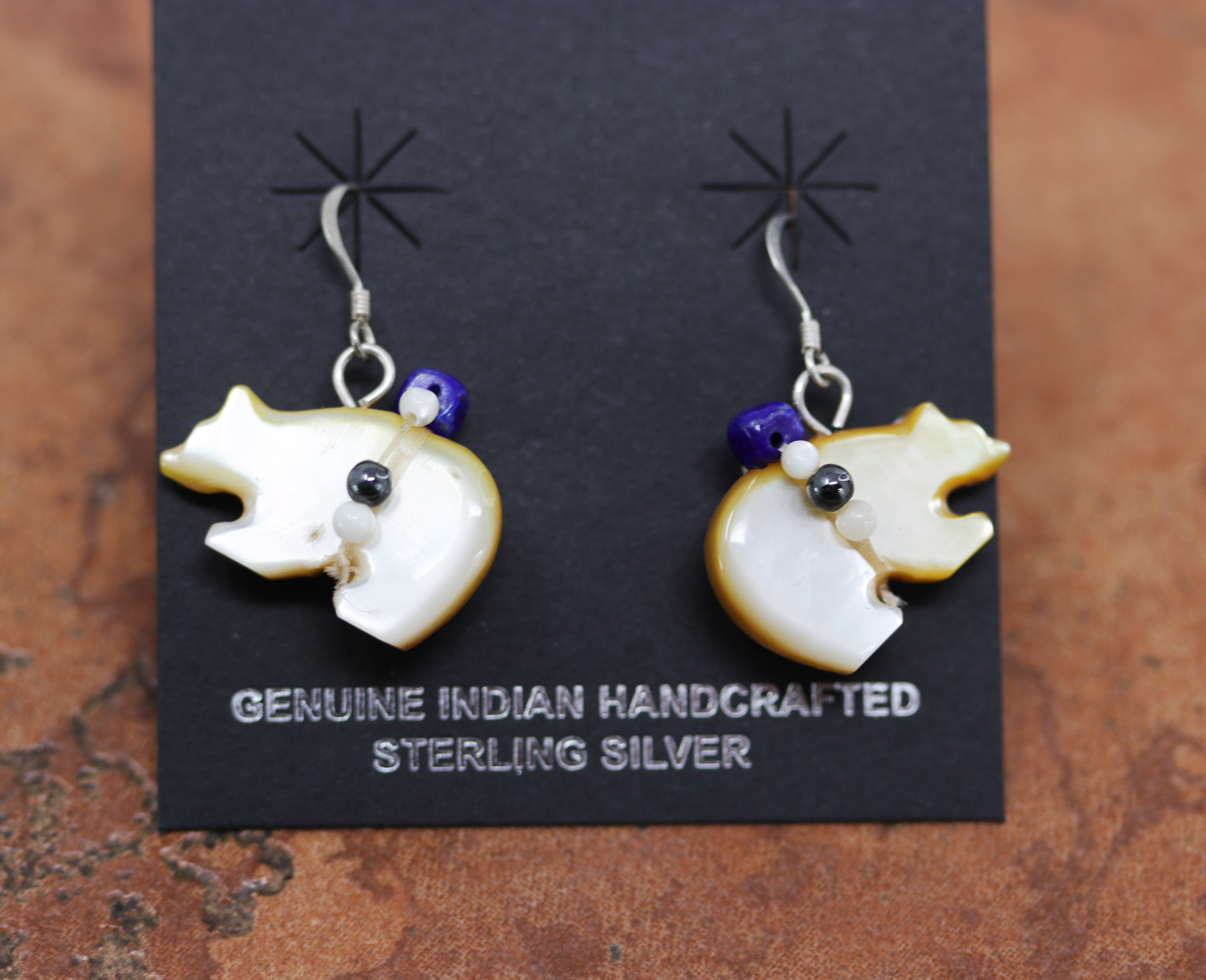 Brand new, very nice, bear Fetish Native American earrings. They are made from sterling silver and multi-stone inlay. The earrings are about 1 3/8" in length and 1" in width.&nbsp;