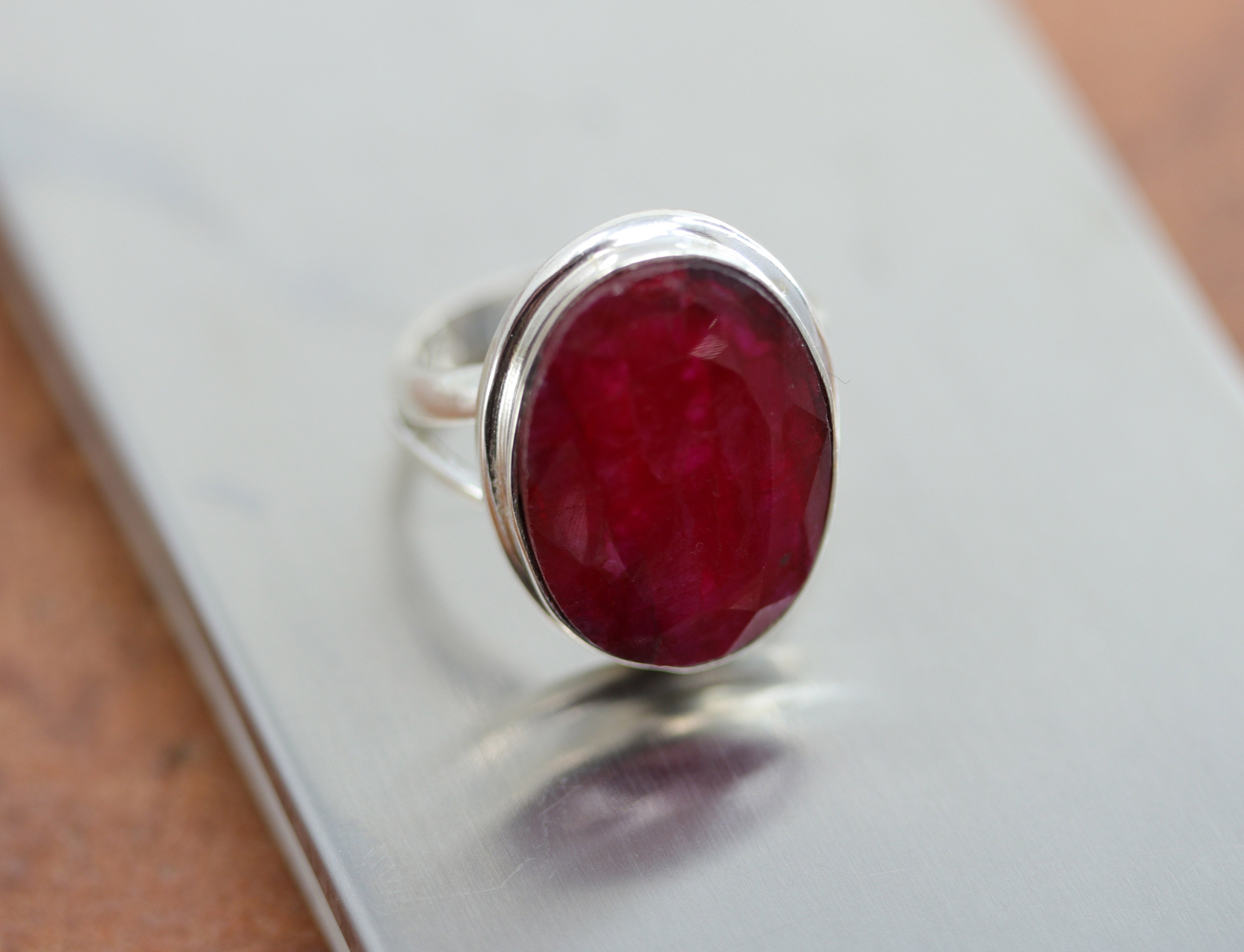 A beautiful Southwest Style gemstone ring made from sterling silver and ruby. The ring size is 5 1/2 and it is 7/8" in length. 