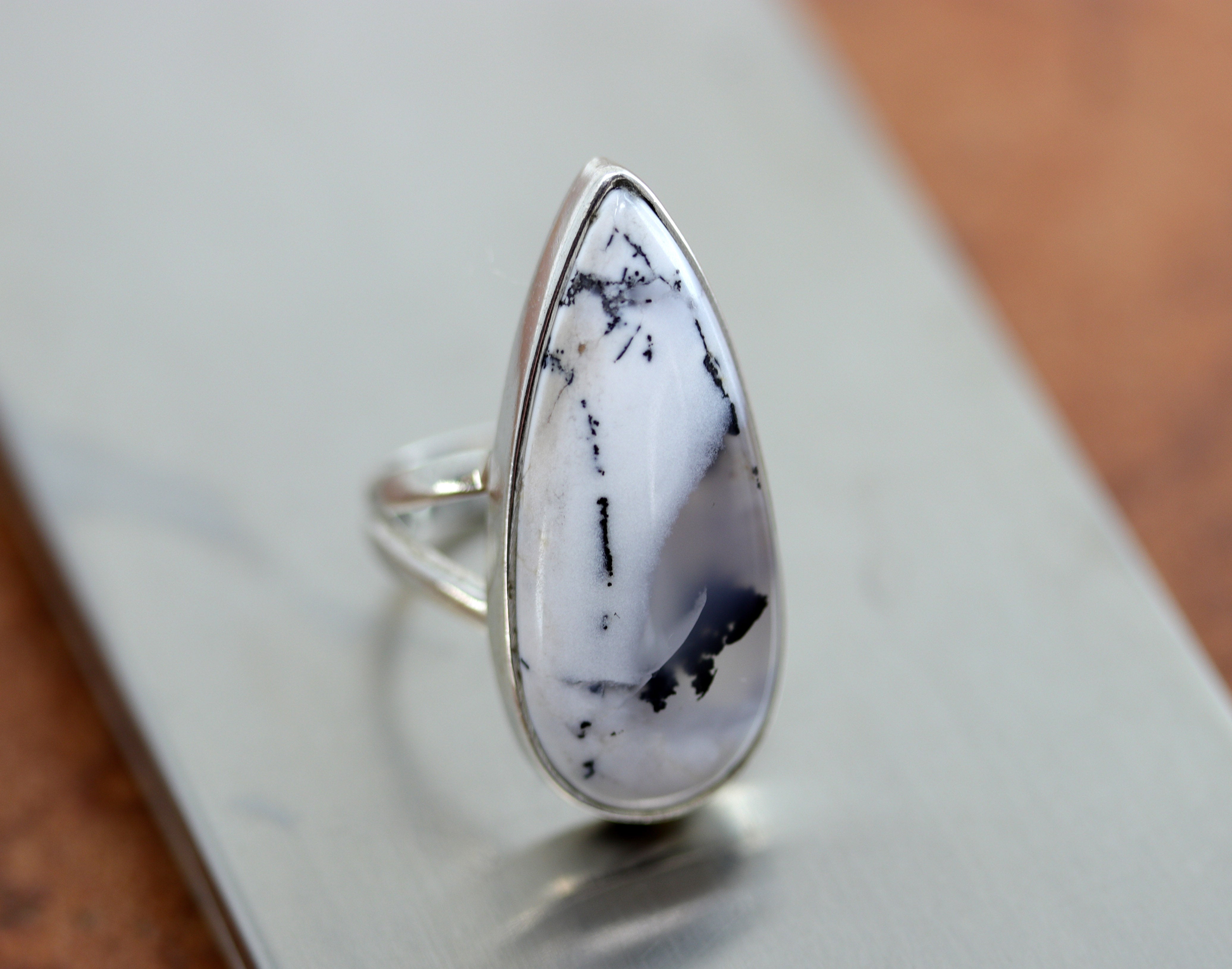 A beautiful Southwest Style black and white gemstone ring made from sterling silver and dendritic. The ring size is 5 1/2 and it is 1 1/4" in length. 