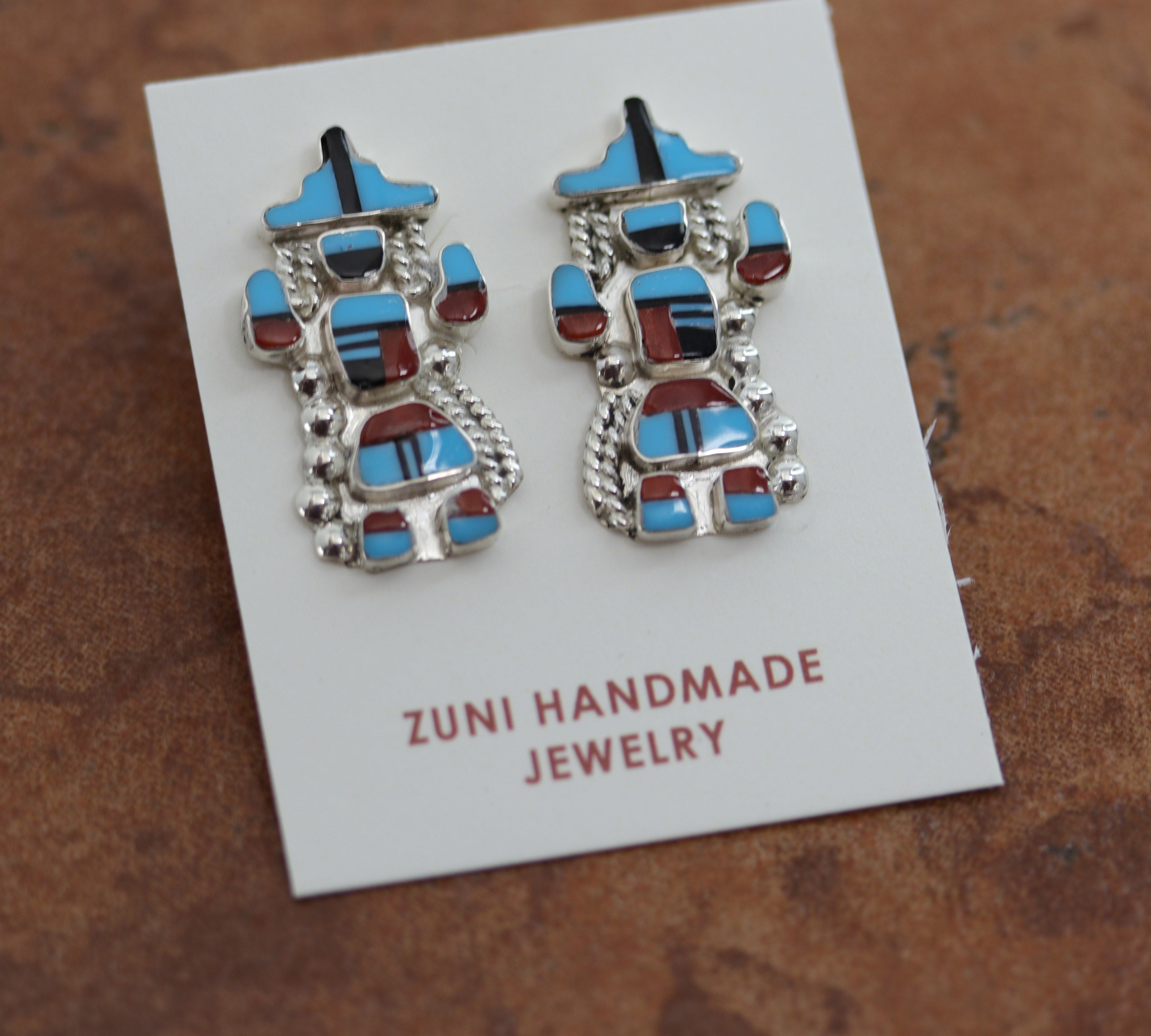 Beautiful Zuni Native American earrings. They are made from sterling silver and multi-stone inlay. Each earring is 1 1/8" in length, and about 5/8" in width.