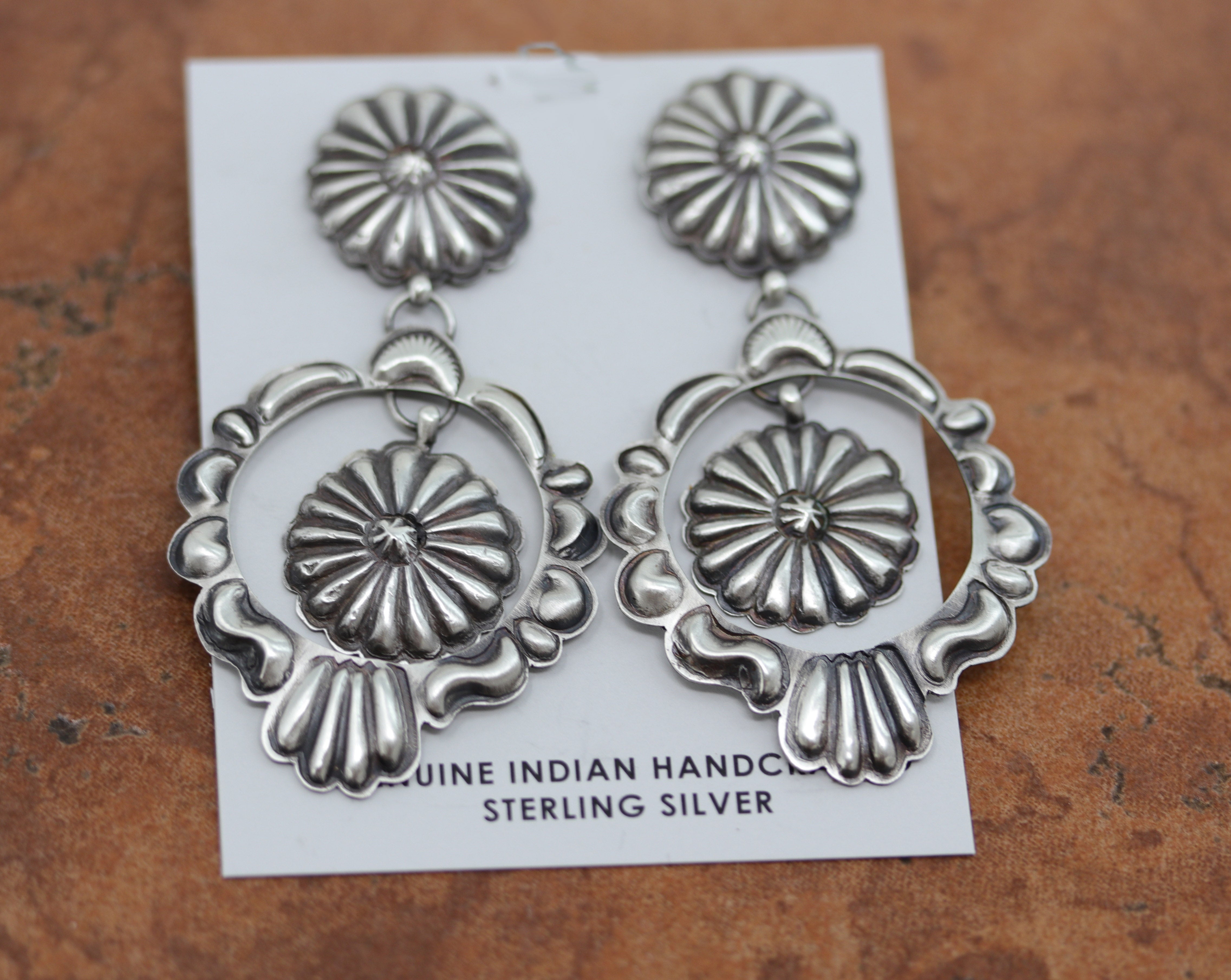 Beautiful Navajo Native American Concho Earrings. They are made from sterling silver. The earrings are about 2 3/4" in length, and about 1 1/2" wide.&nbsp;