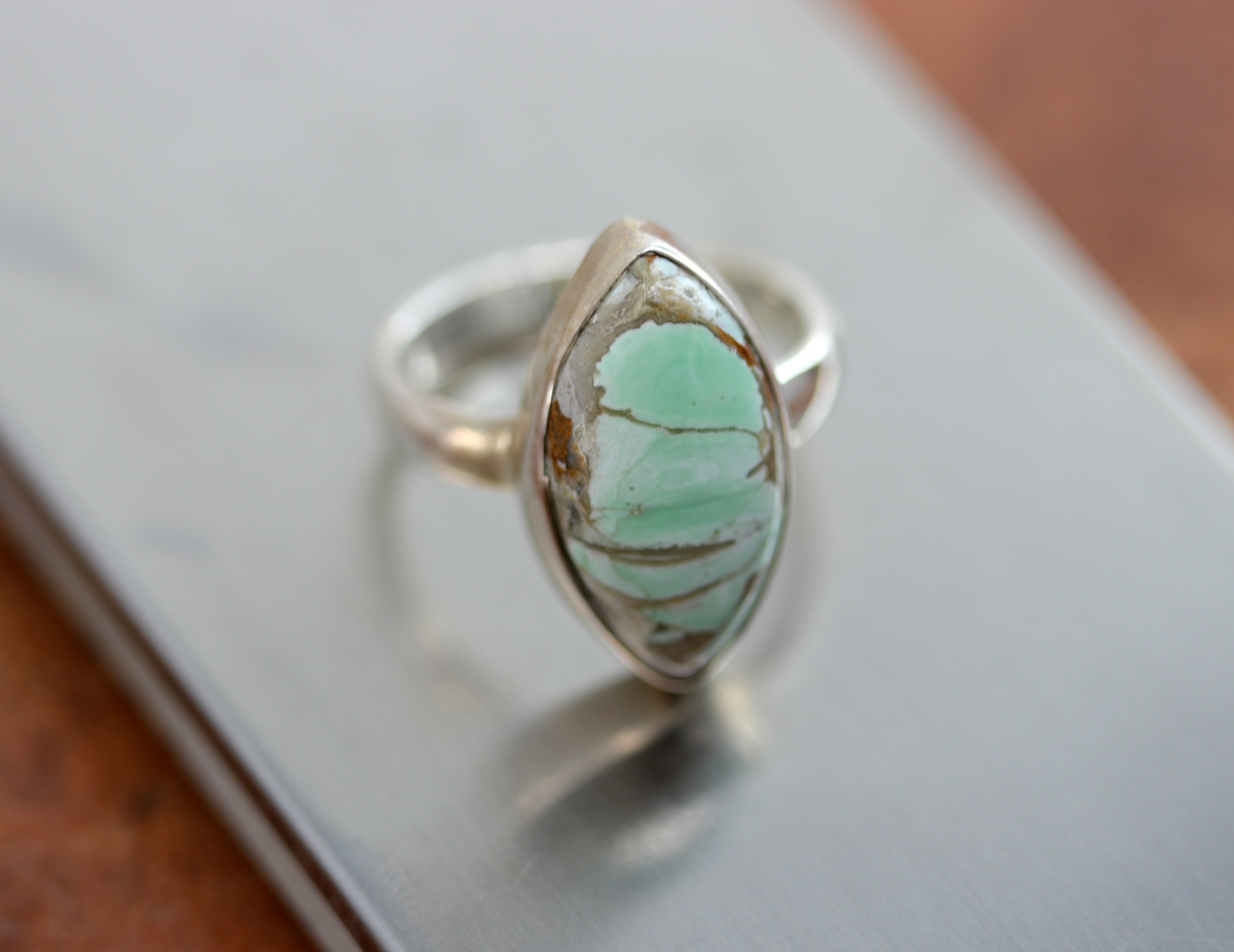 A beautiful Southwest Style gemstone ring made from sterling silver and variscite. The ring size is 7 and it is 7/8" in length.