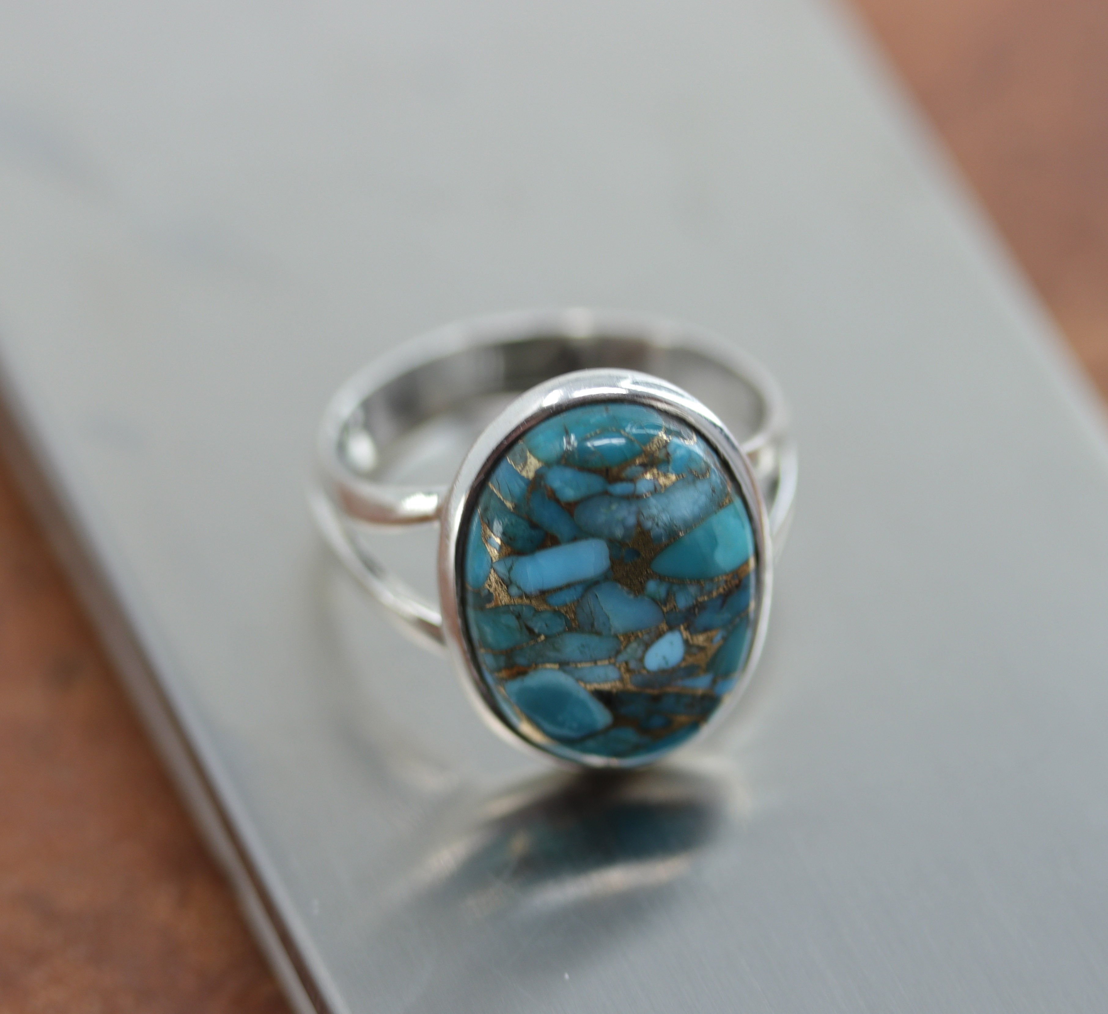 A beautiful Southwest Style gemstone ring made from sterling silver and turquoise. The ring size is 9 1/2 and it is 7/8" in length. 