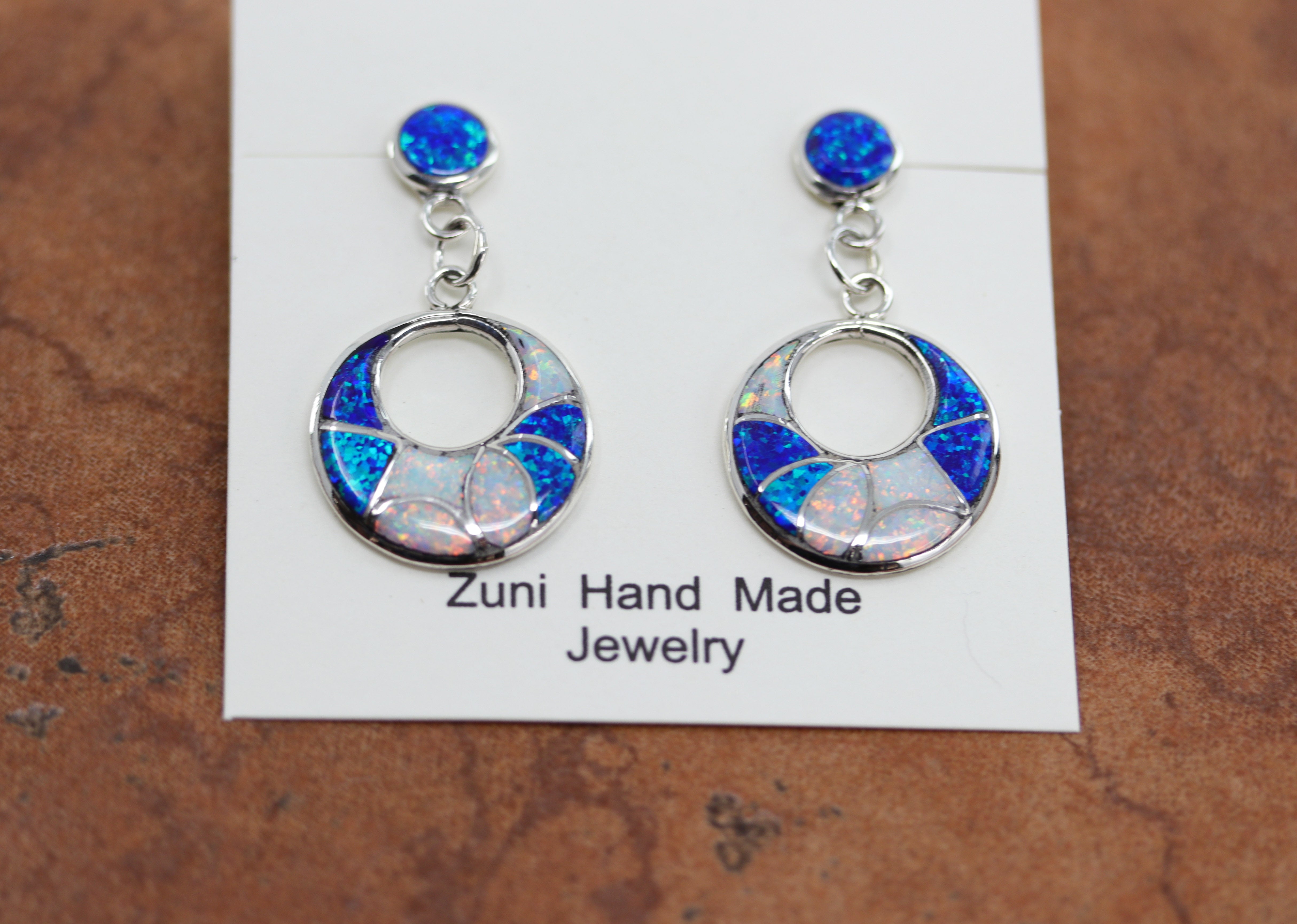 Brand new, very nice, Zuni Native American earrings. They are made from sterling silver and created opal. The earrings are about 1 1/2" in length and 7/8" in width.&nbsp;