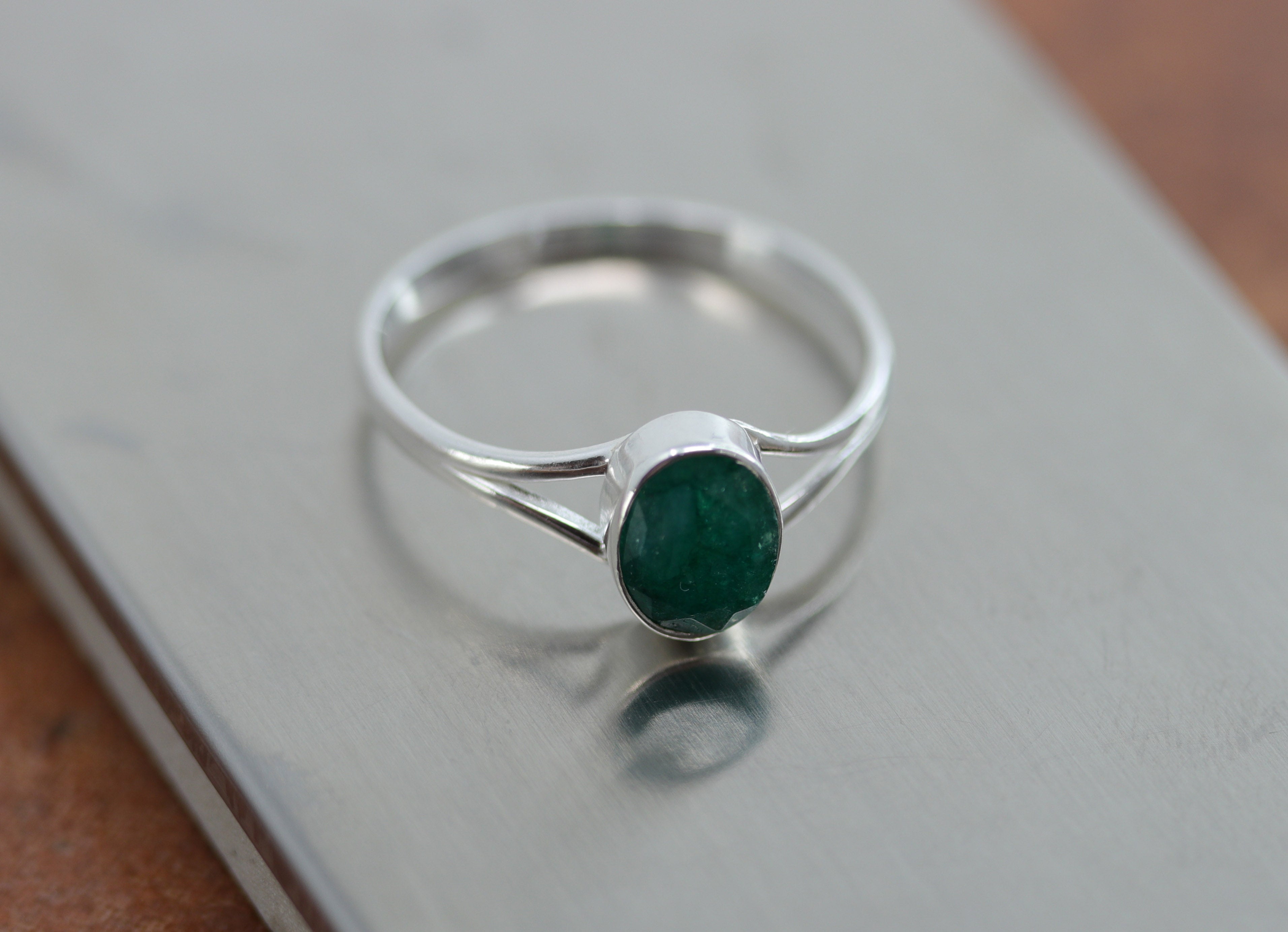 A beautiful Southwest Style gemstone ring made from sterling silver and emerald. The ring size is 8 1/2 and it is 3/8" in length.