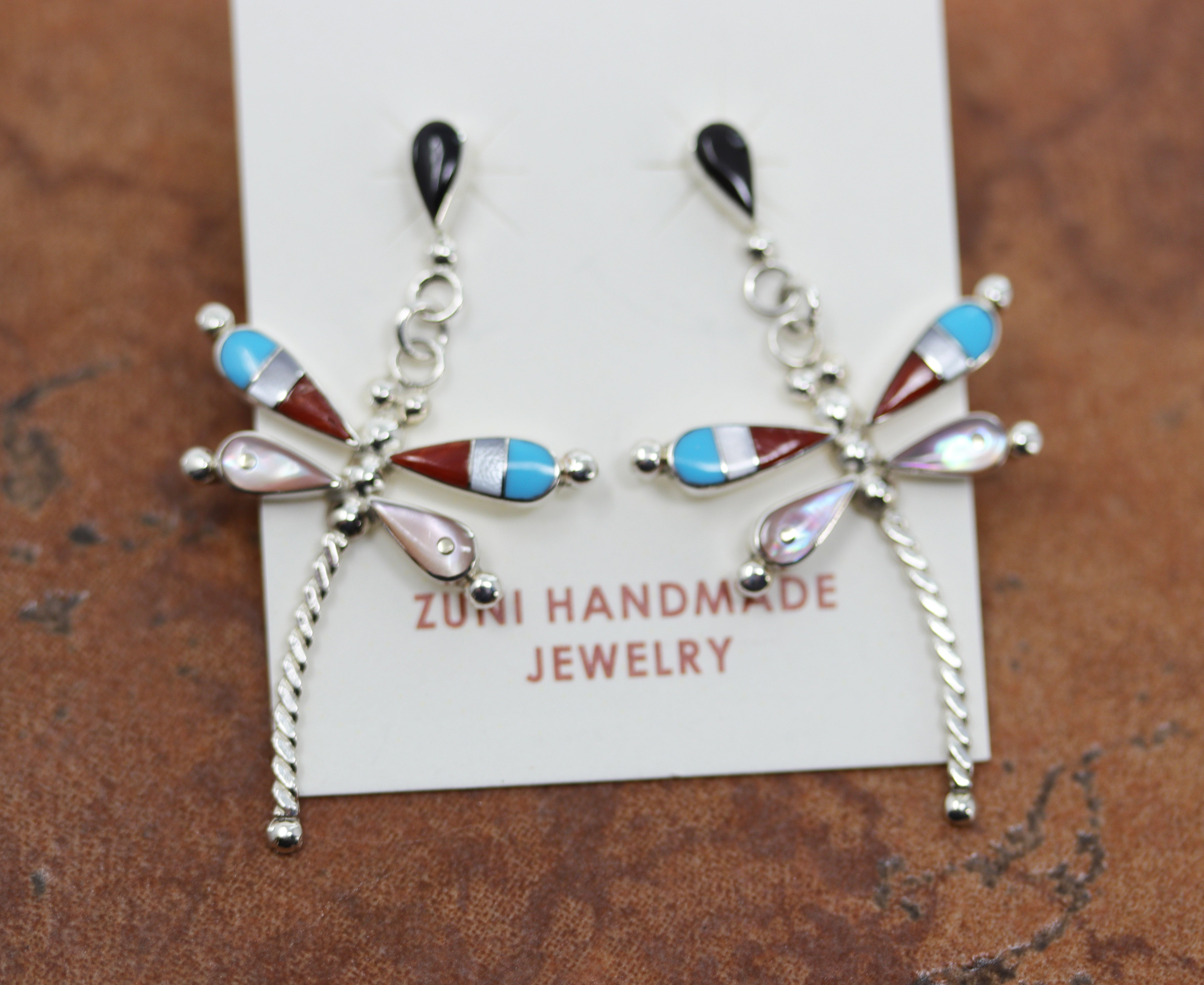 Beautiful Zuni Native American earrings. They are made from sterling silver and multi-stone inlay. Each earring is 1 1/2" in length, and about 7/8" in width.