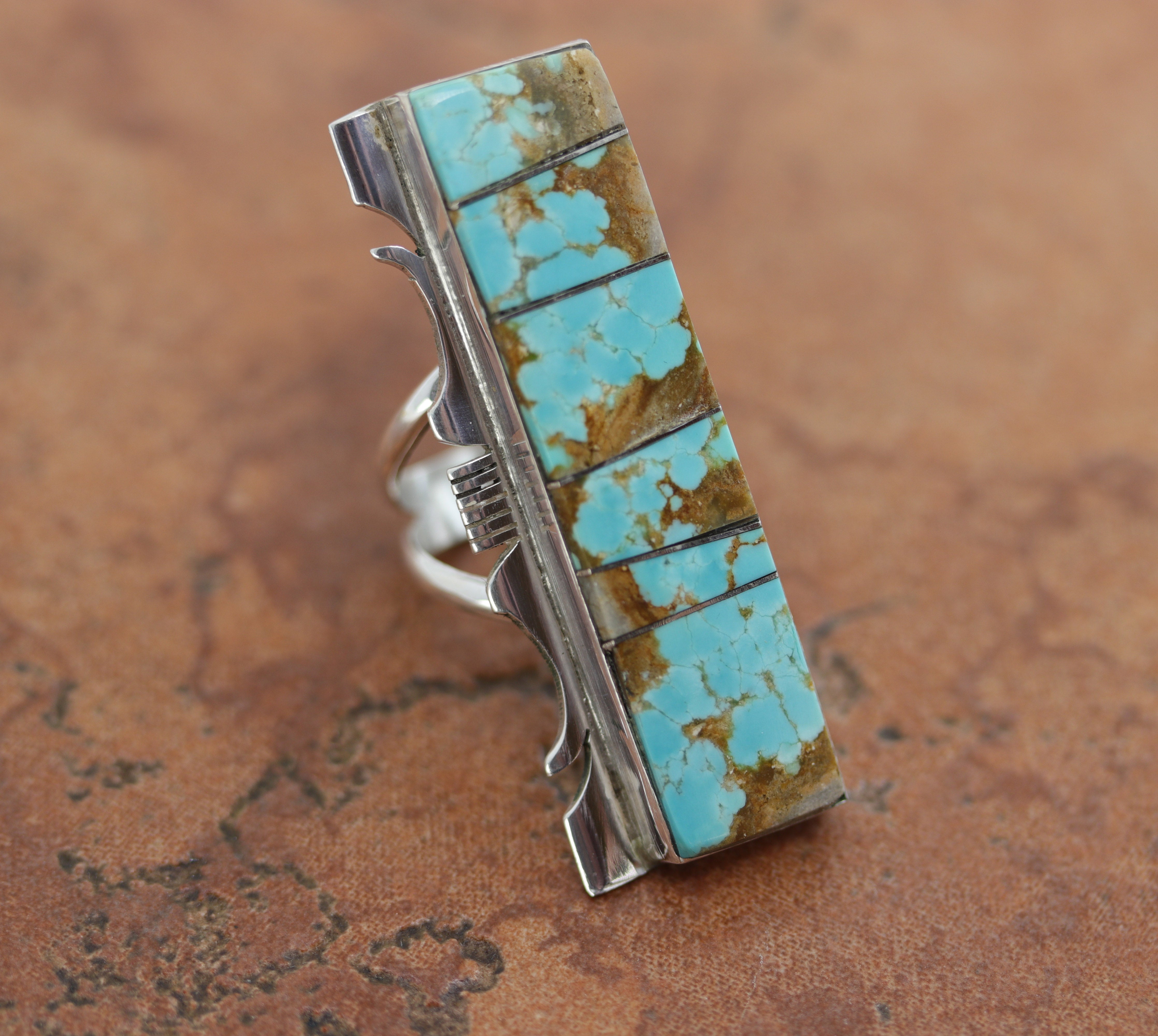 Beautiful Navajo Native American ring. It is made from sterling silver and turquoise. The ring size 8 and it is 2" in length.