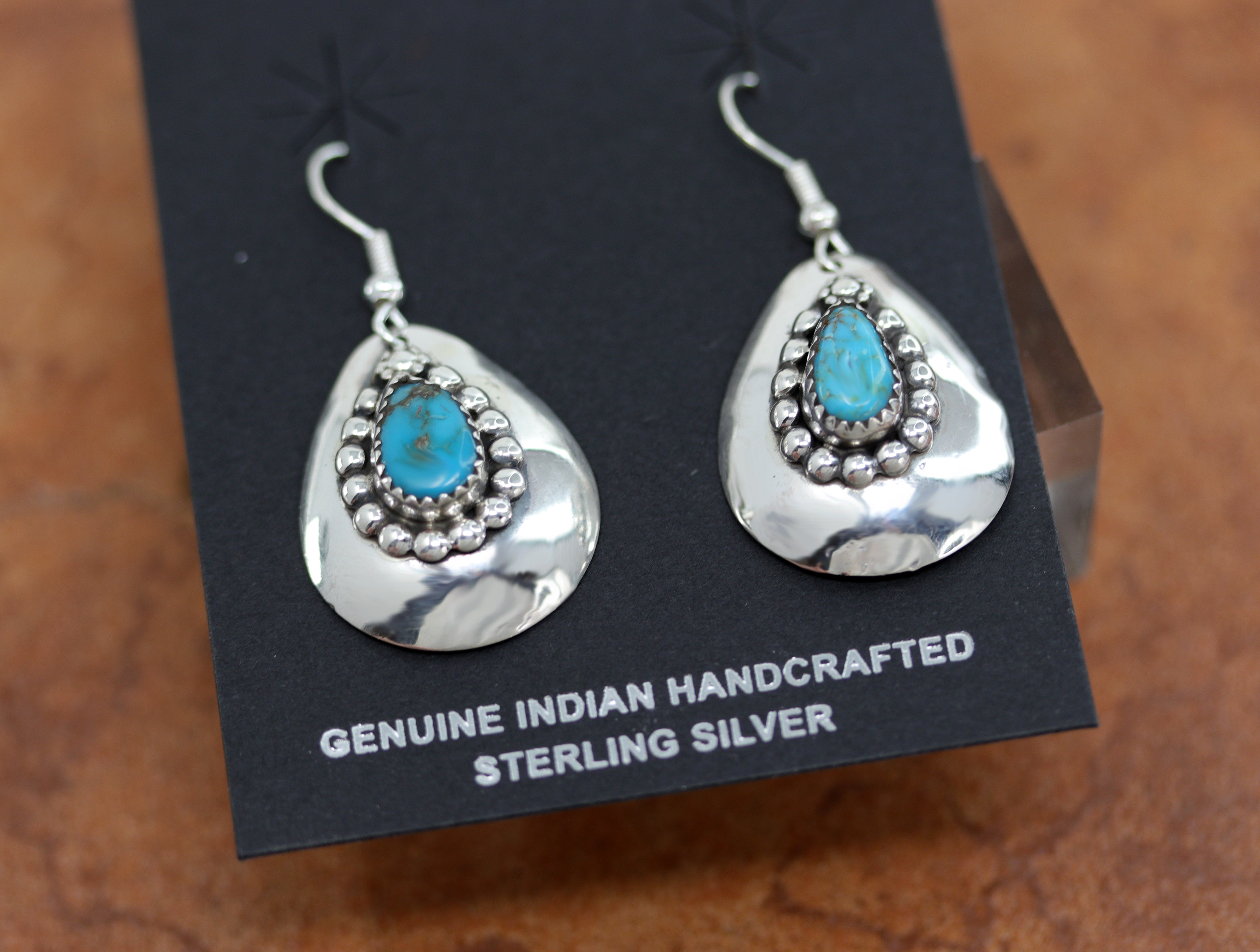 A beautiful Navajo Native American earrings. They are made from sterling silver and turquoise. The earrings are about 1 3/4" in length including the hook and 1" wide.&nbsp;