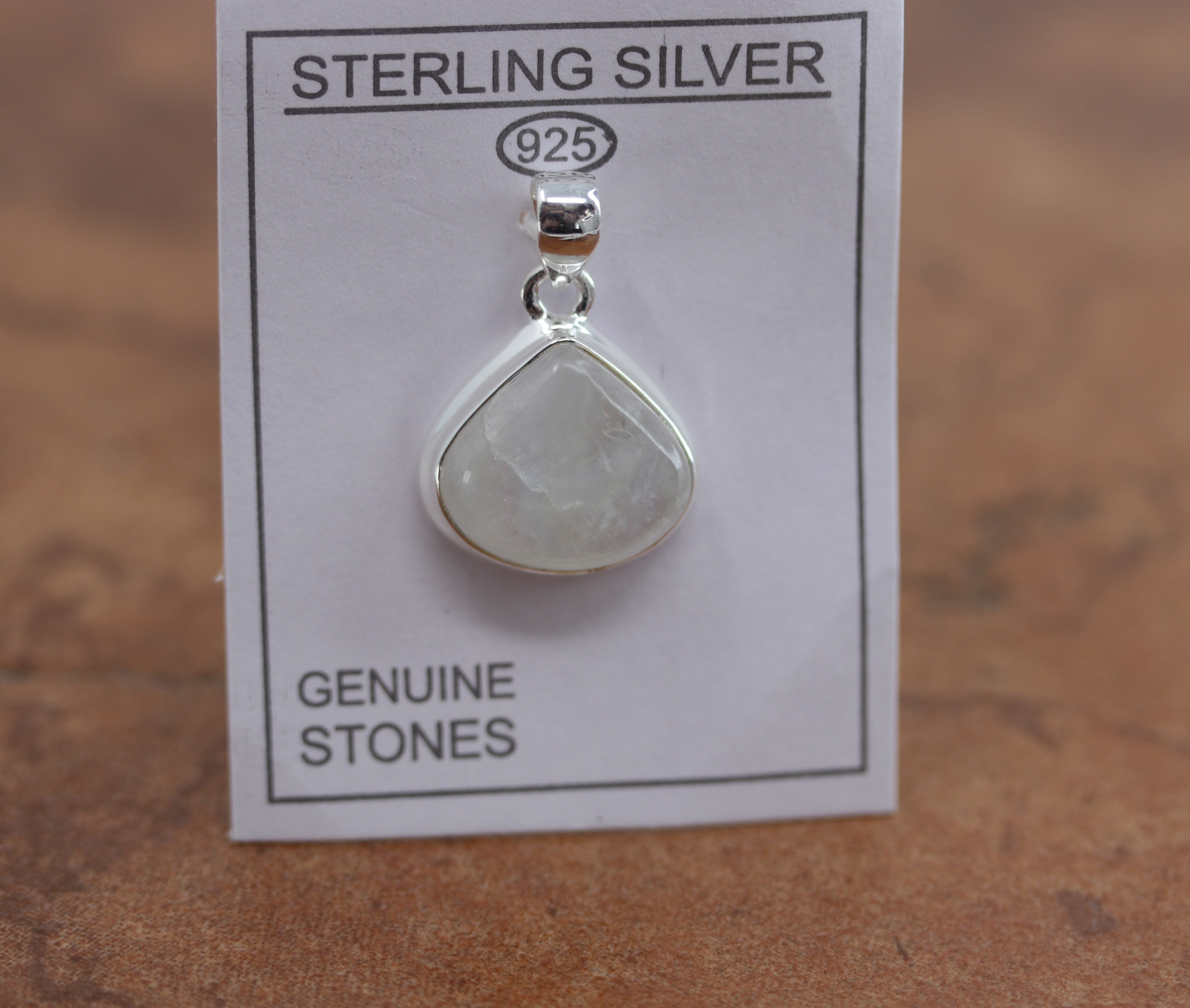 A beautiful oval pendant made from Sterling Silver and moonstone. It is about 1 1/8" in length including the bail, and about 3/4" in width. 