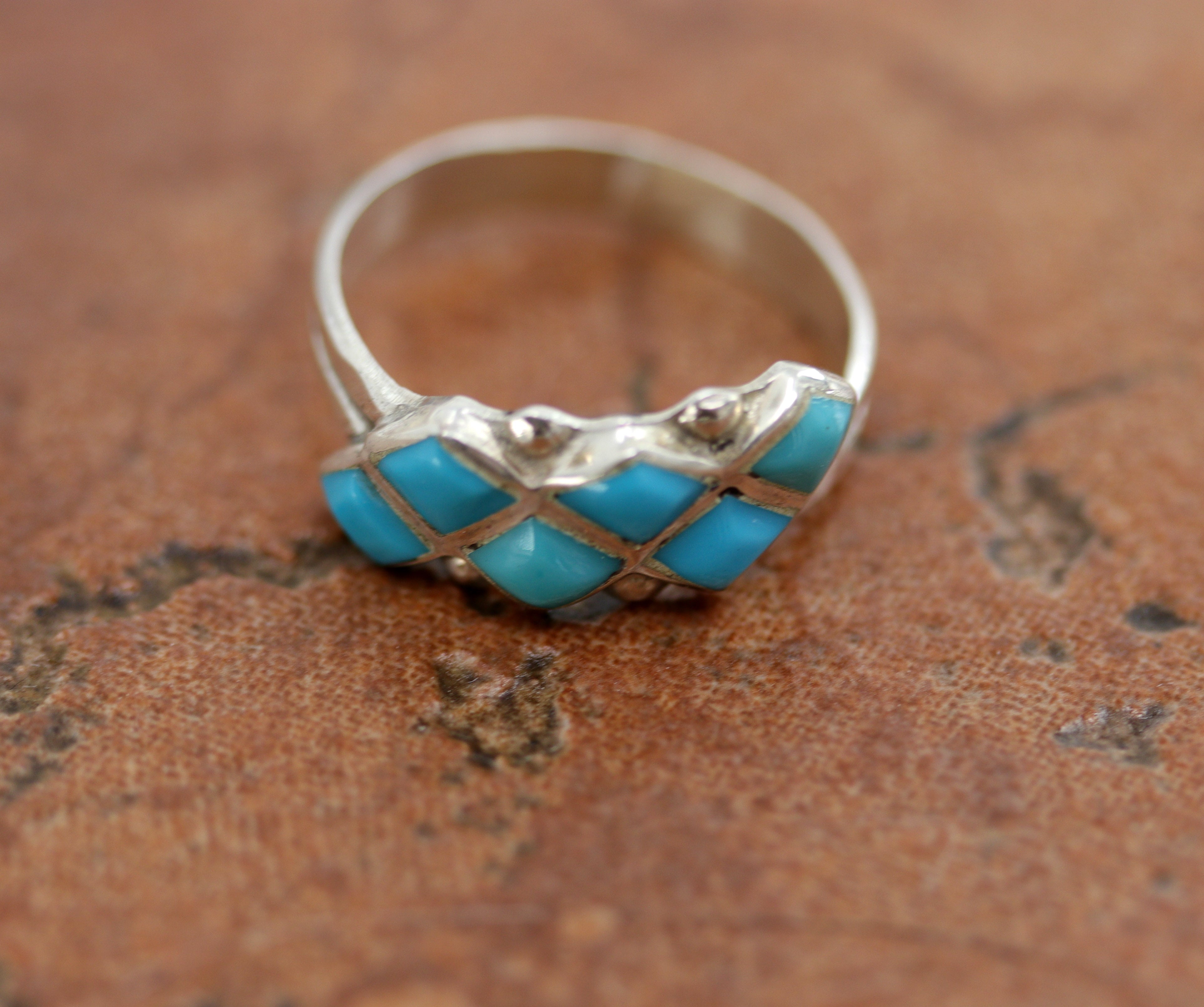 Zuni Native American ring. It is made from sterling silver and turquoise. The ring size 5 and it is 3/8" in length.