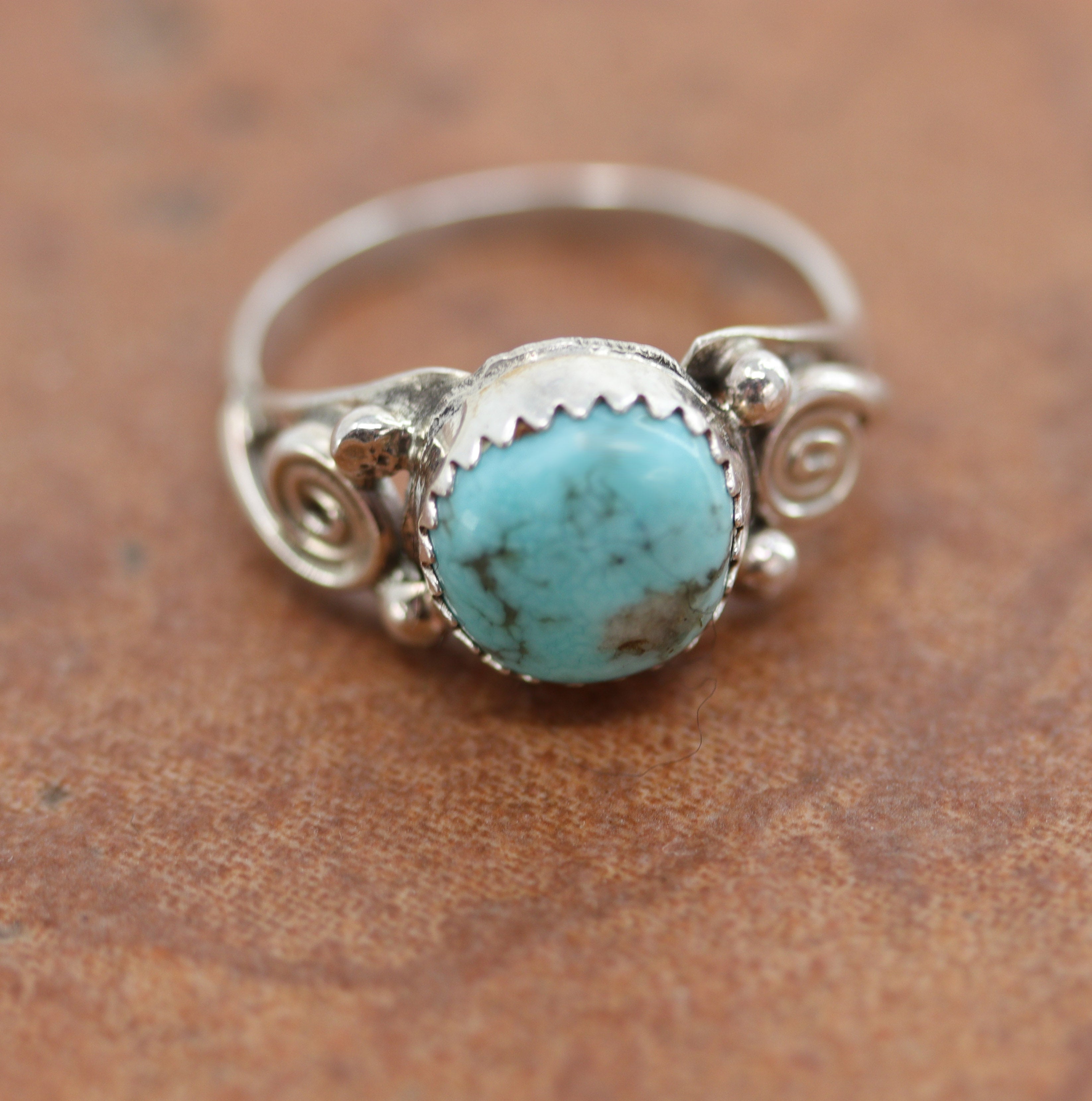 Beautiful Navajo Native American ring. It is made from sterling silver and turquoise. The ring size 7 1/2 and it is 1/2" in length.