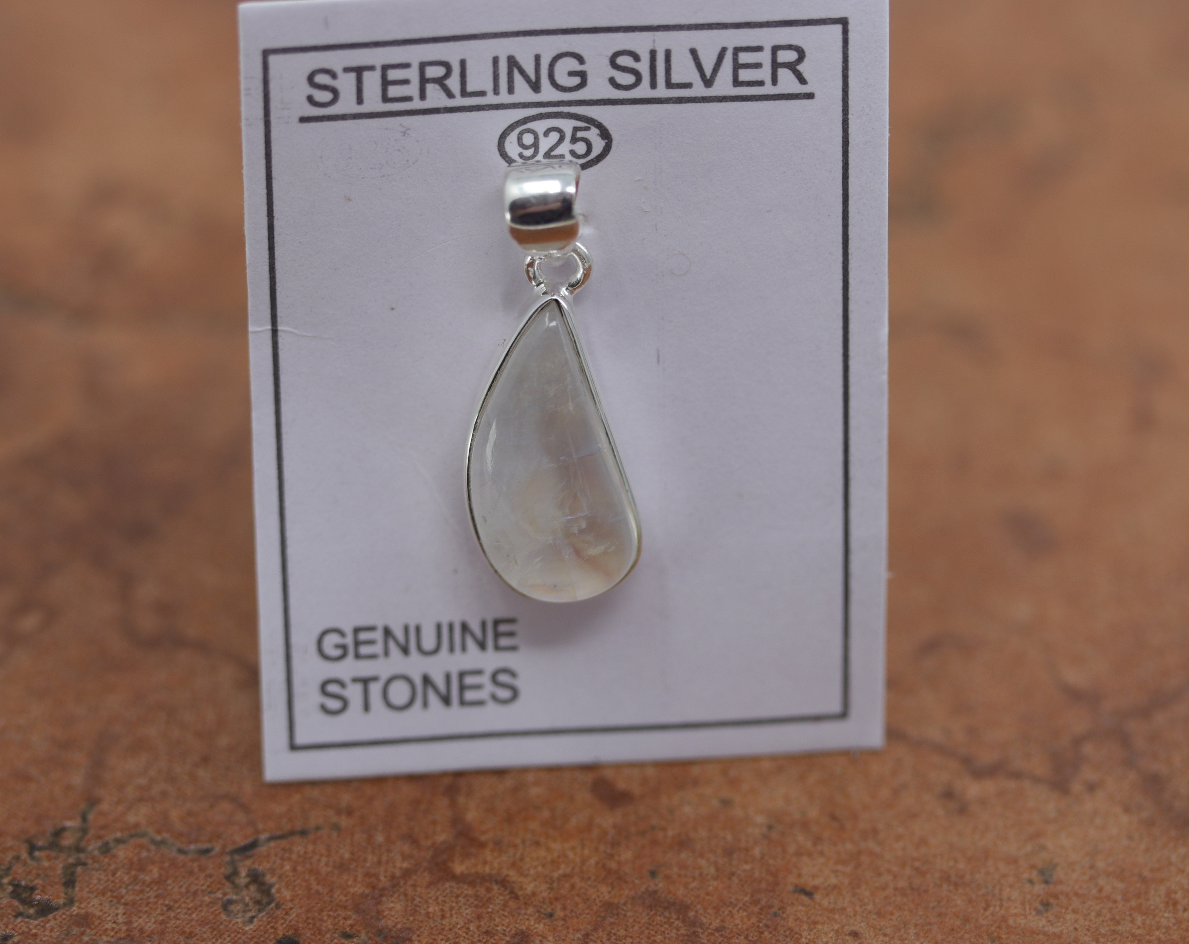 A beautiful oval pendant made from Sterling Silver and moonstone. It is about 1 1/4" in length including the bail, and about 1/2" in width.