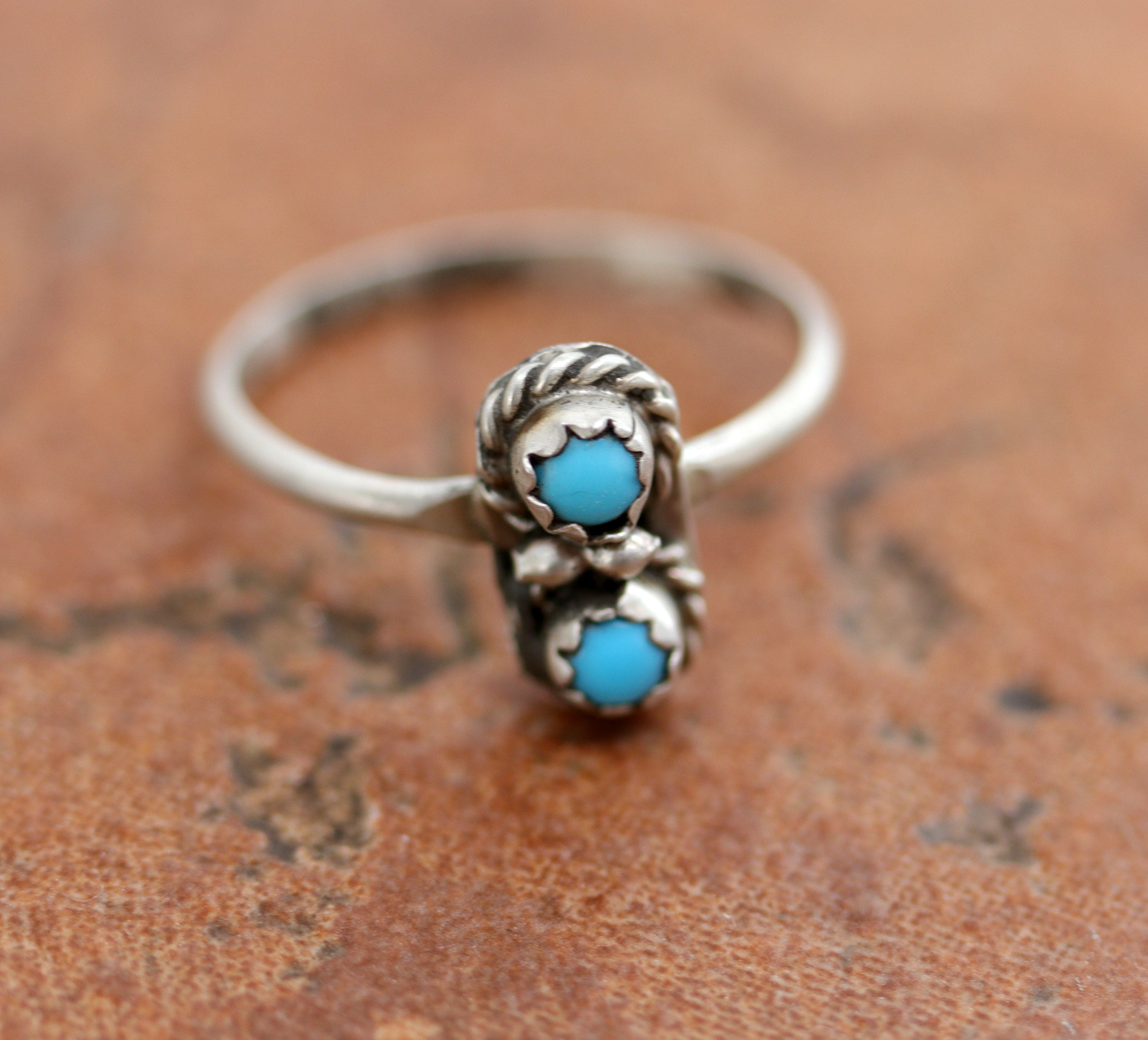 Beautiful Navajo Native American ring. It is made from sterling silver and turquoise. The ring size 7 1/2 and it is 1/2" in length.