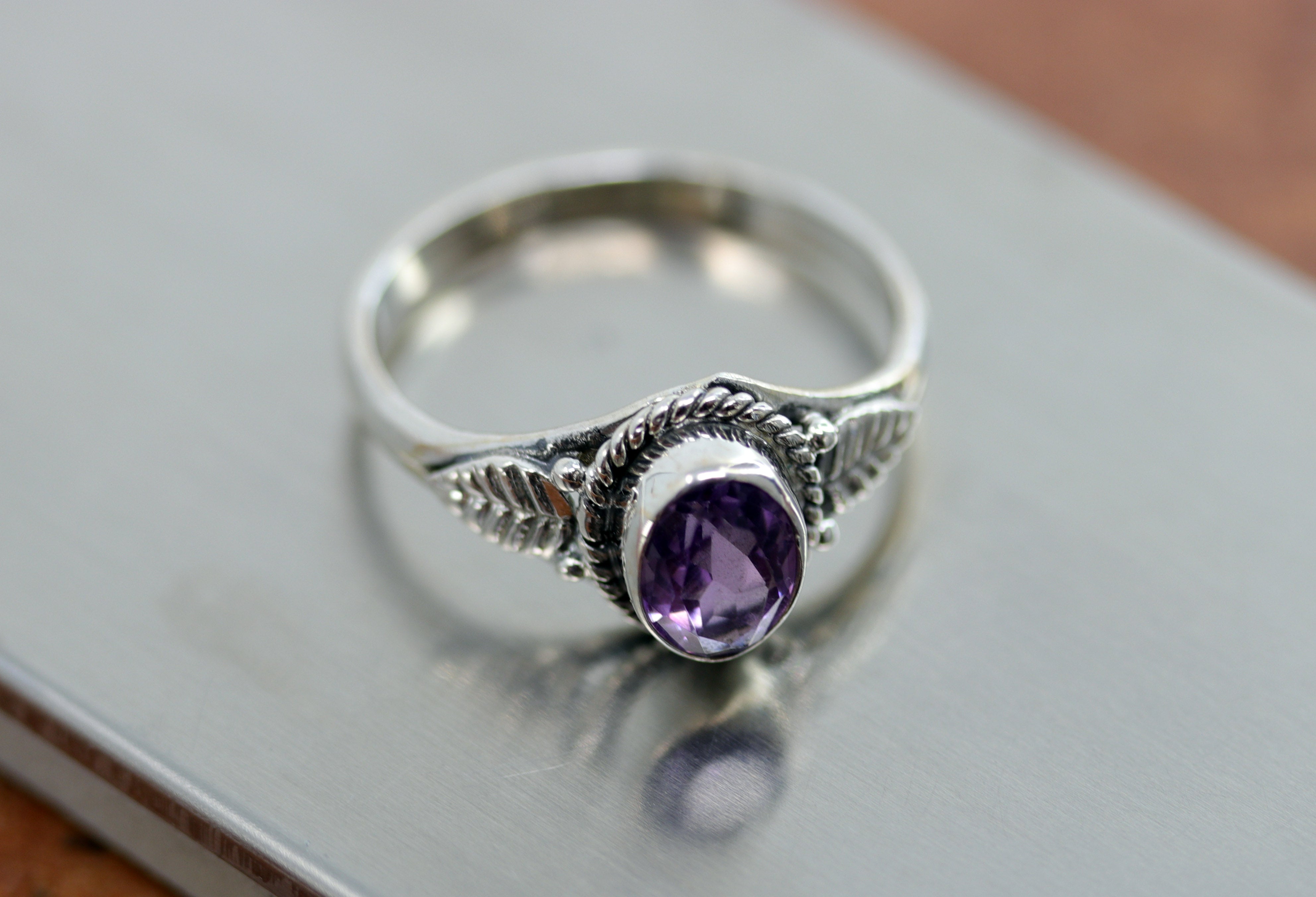 A beautiful Southwest Style gemstone ring made from sterling silver and amethyst. The ring size is 10 and it is 1/2" in length.