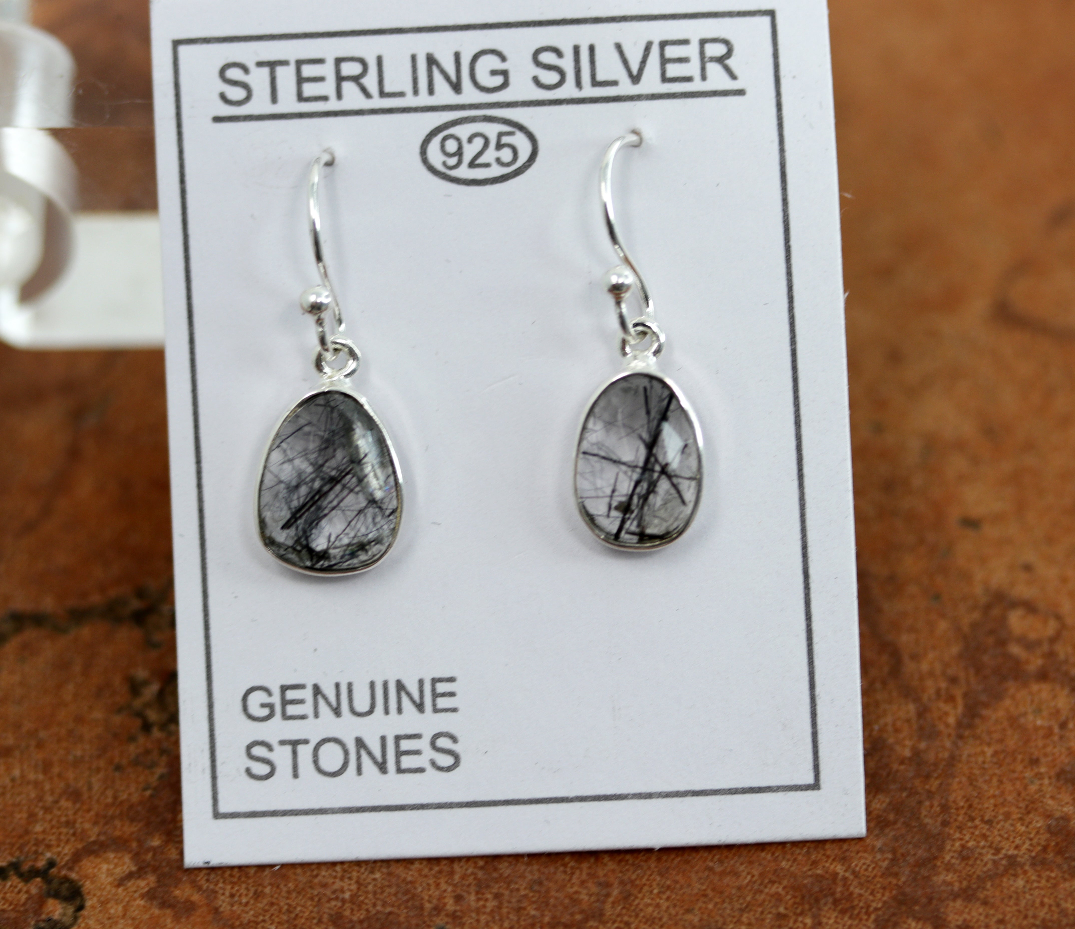 Beautiful earrings made from sterling silver and tourmalated quartz. The earrings are about 1 1/4" in length including the hook and 1/2" in width. 