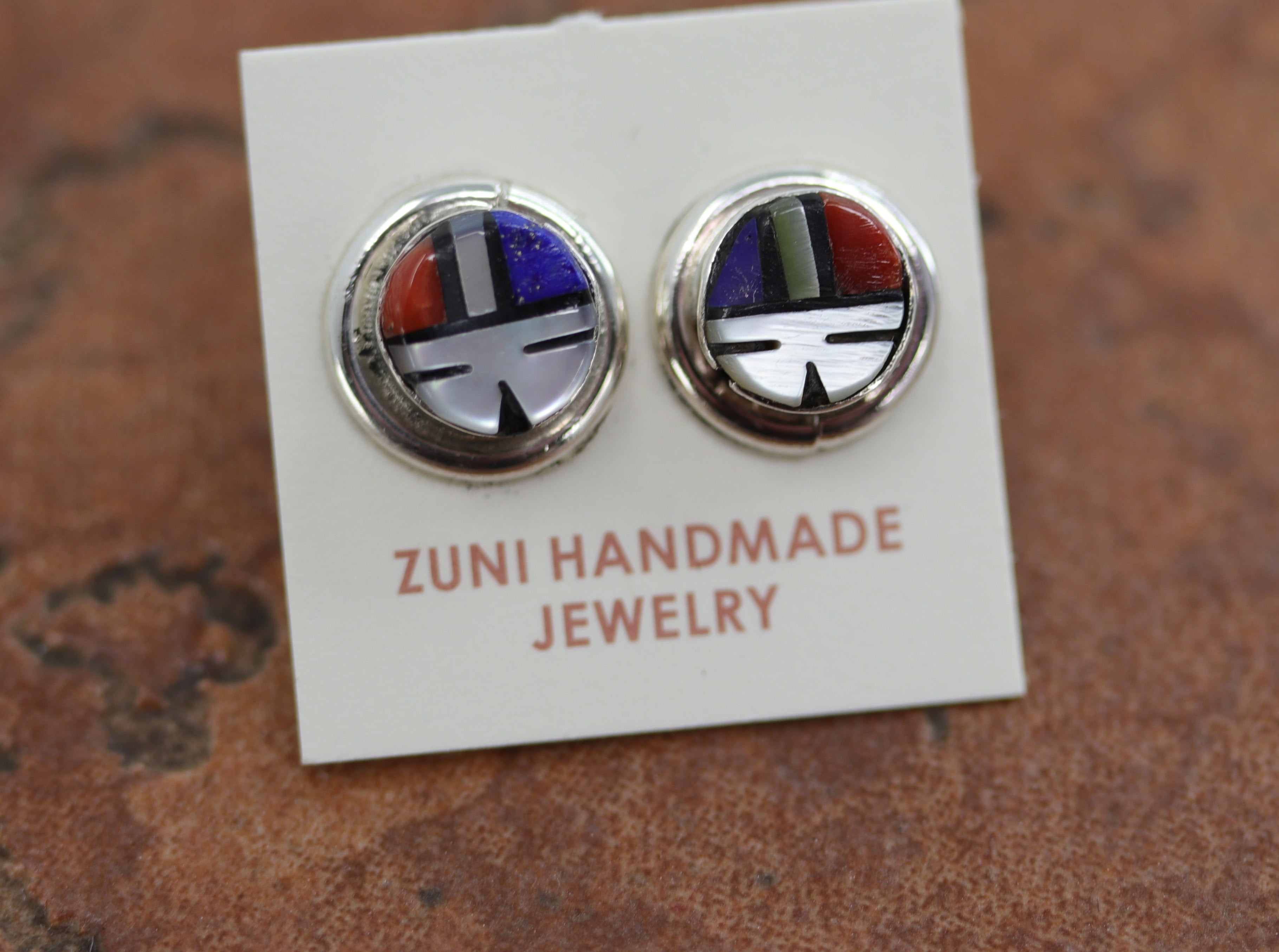 Brand new, very nice, Zuni Native American earrings. They are made from sterling silver and multi-stone inlay. The earrings are about 7/16" in diameter.