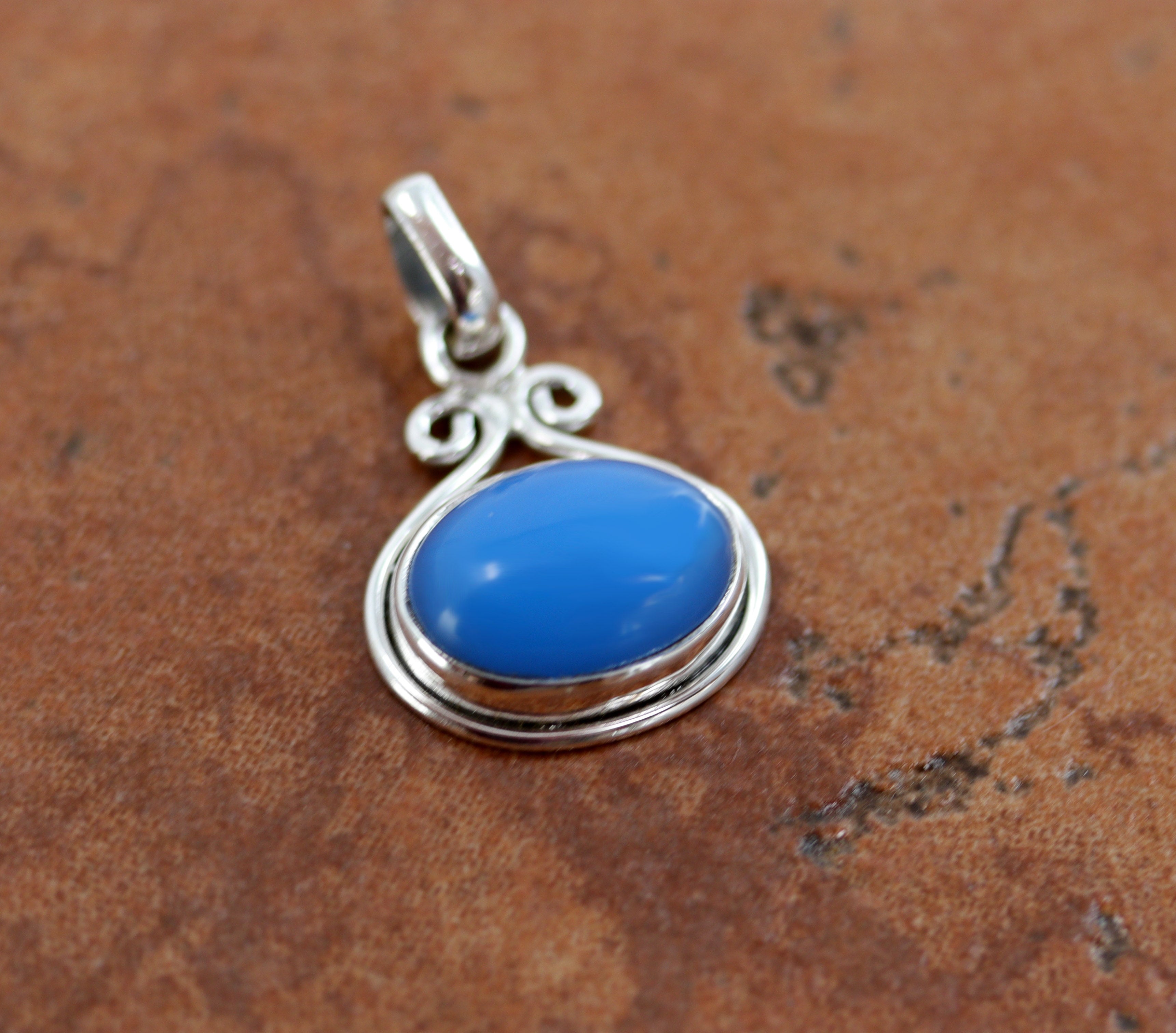 A lovely pendant made from sterling silver and Blue Chalcedony. The pendant is 1" in length including the bail, and 3/4" in width.