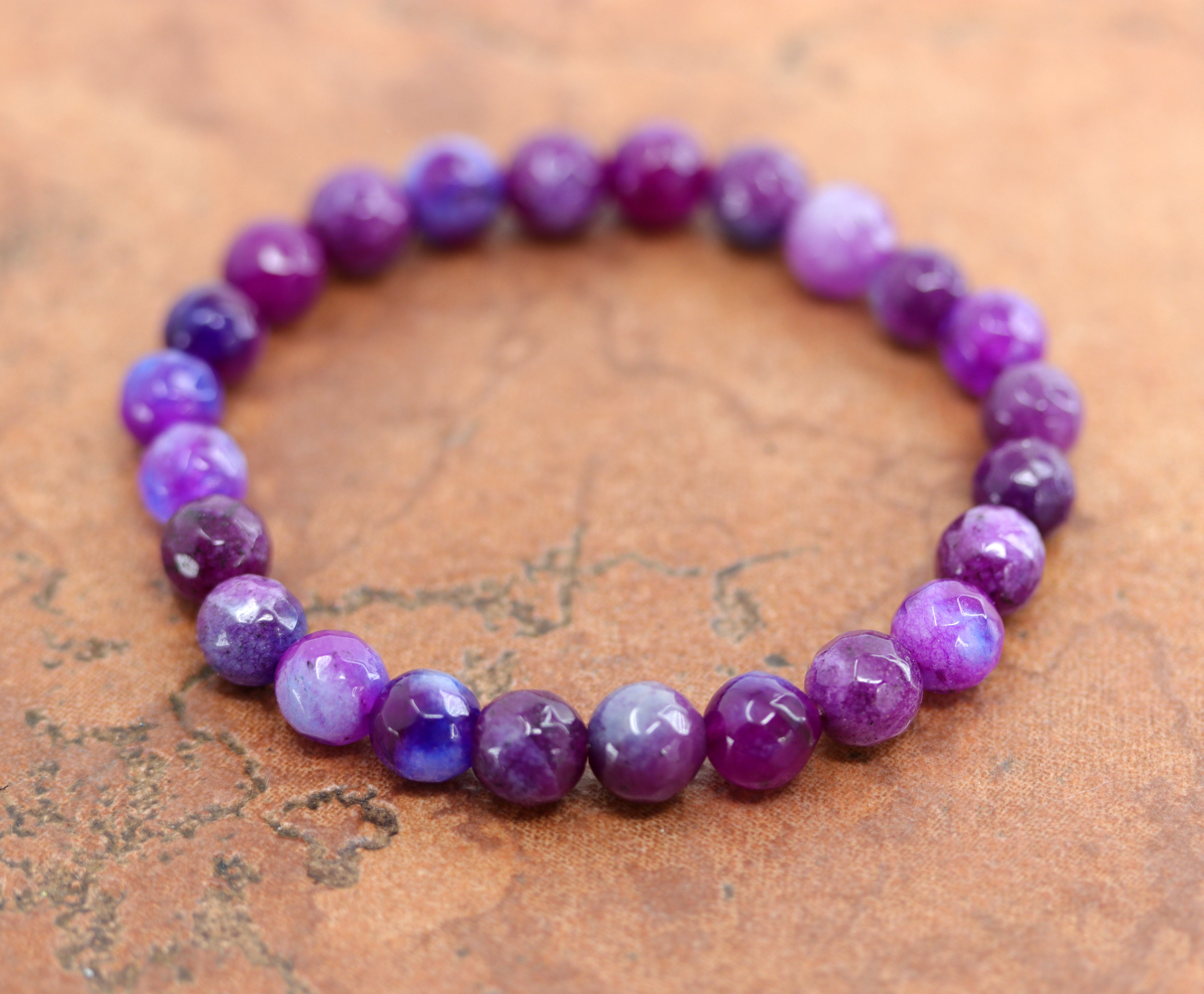 A beautiful purple sugilite bubble bracelet. It fits sizes 6" (more loose) to about 9" (tighter fit). The width of the bracelet is 8 mm.