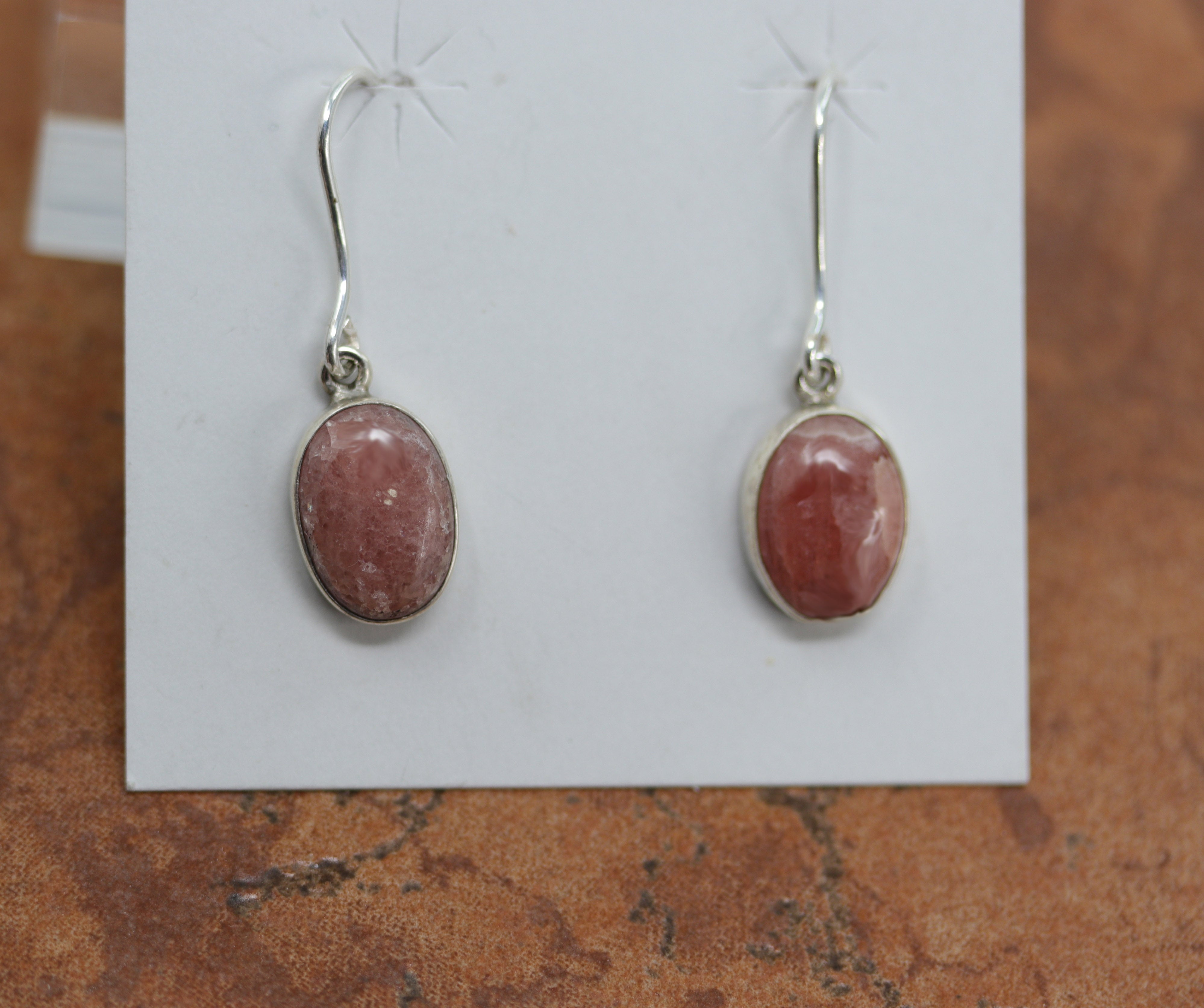 Beautiful pink quartz earrings. The hooks are made from sterling silver and pink quartz. The earrings are about 1 3/8" in length including the hook, and 3/8" in width. 