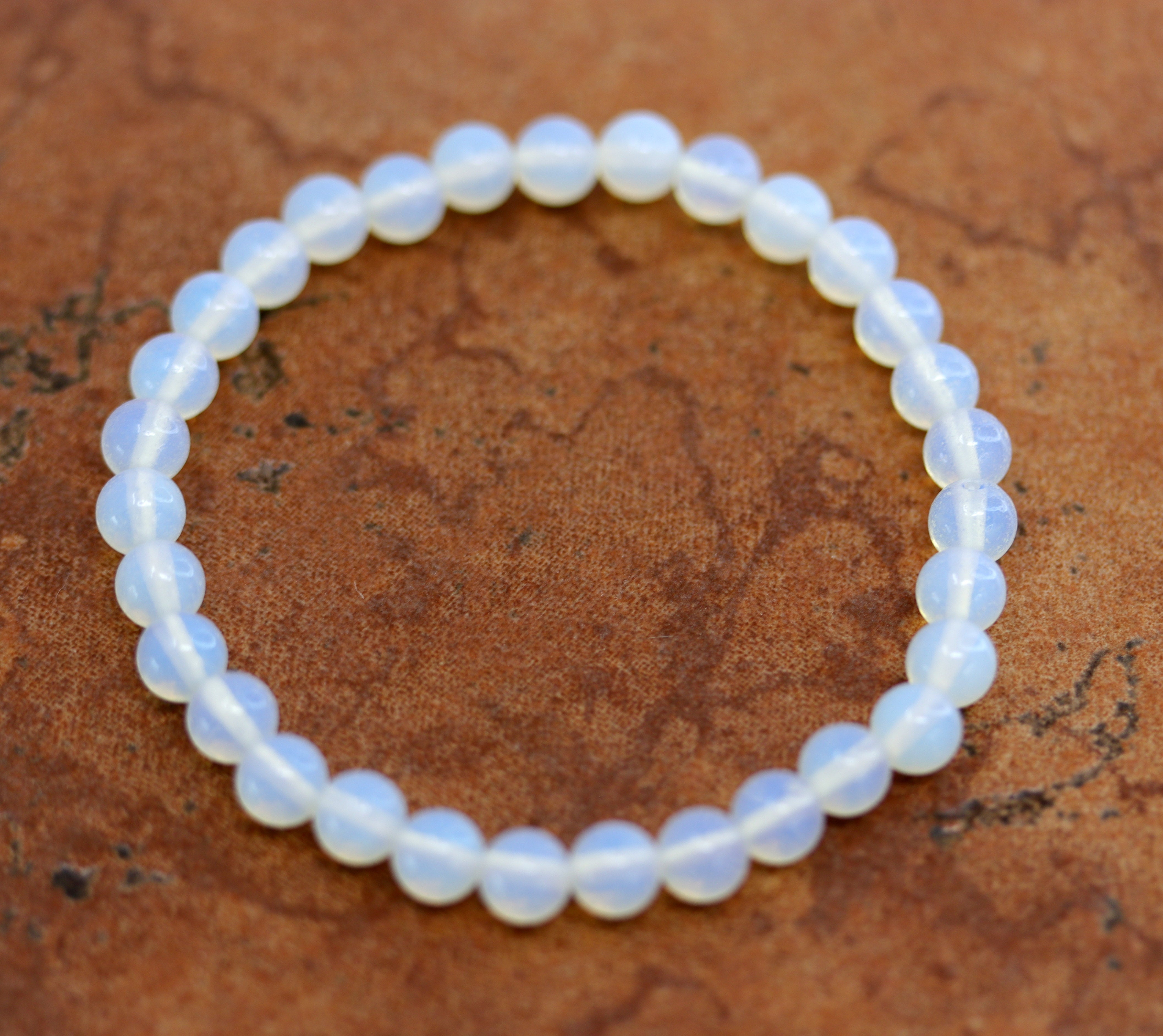 A beautiful opalite bubble bracelet. It fits sizes 6" (more loose) to about 9" (tighter fit). The width of the bracelet is 6 mm. 