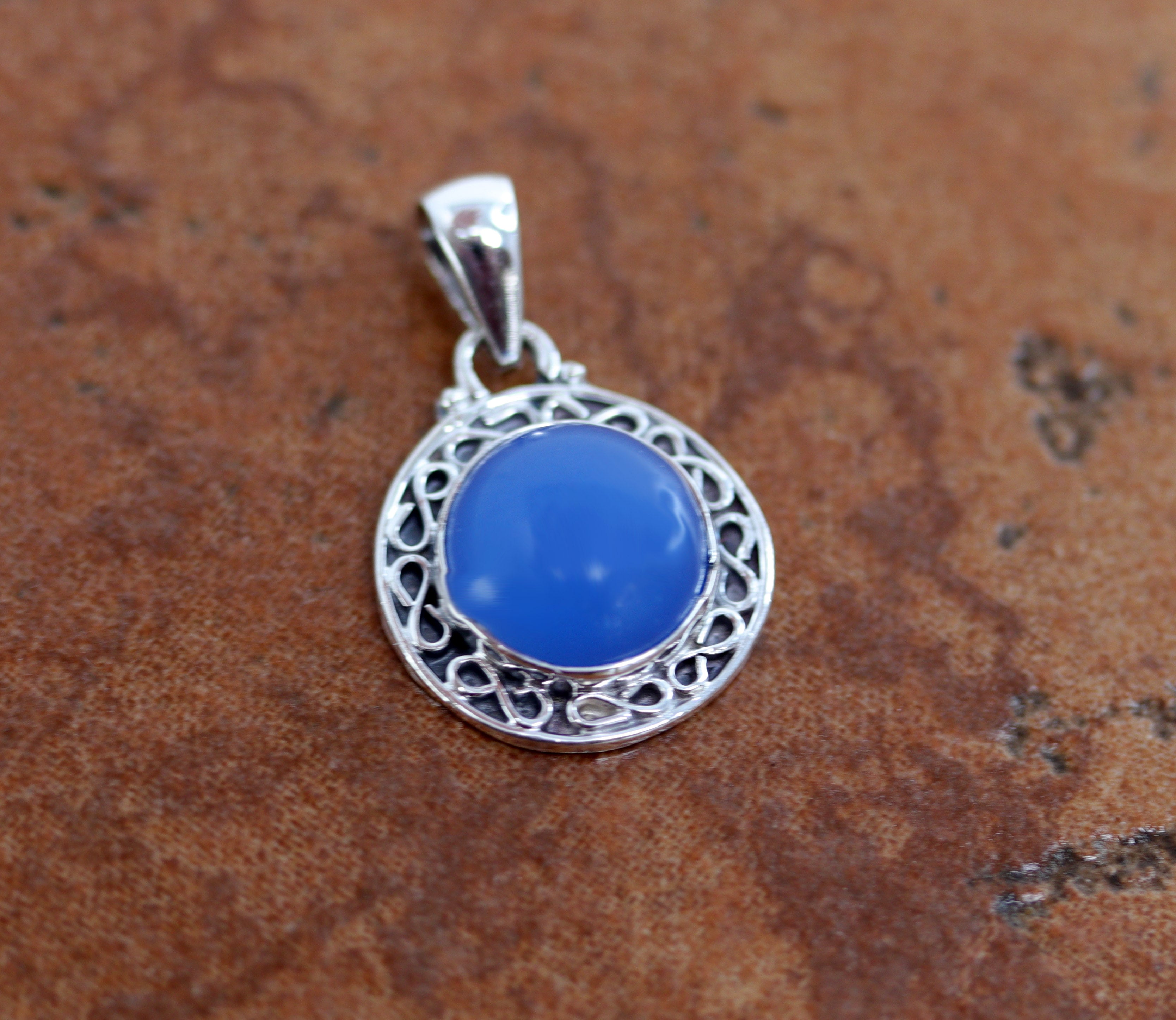 A lovely pendant made from sterling silver and Blue Chalcedony. The pendant is 1 1/8" in length including the bail, and 3/4" in width. 