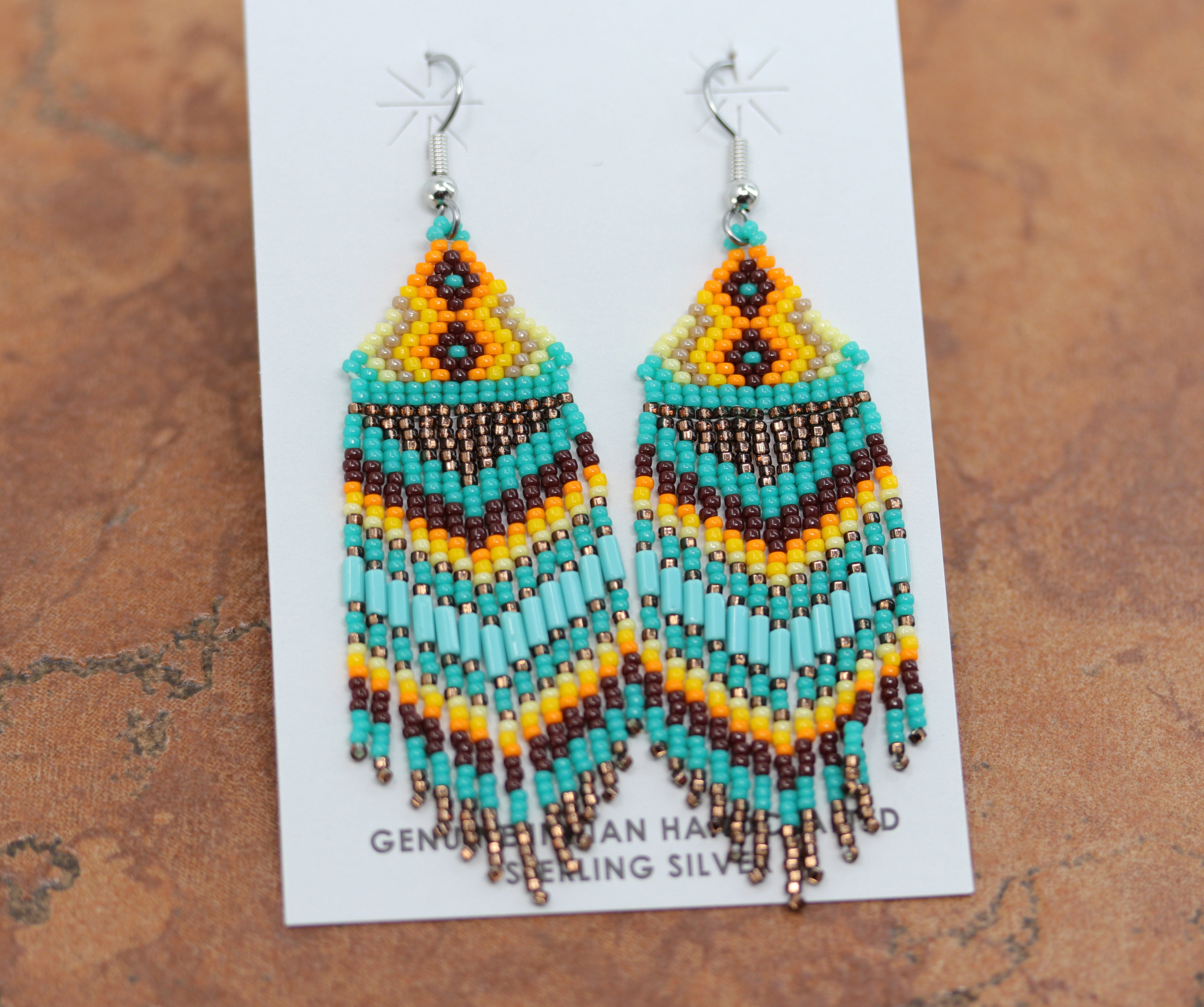 Beautiful Navajo Silver Beaded Earrings. They are made from sterling silver. The earrings about 3" long including the hook and 1" in width.