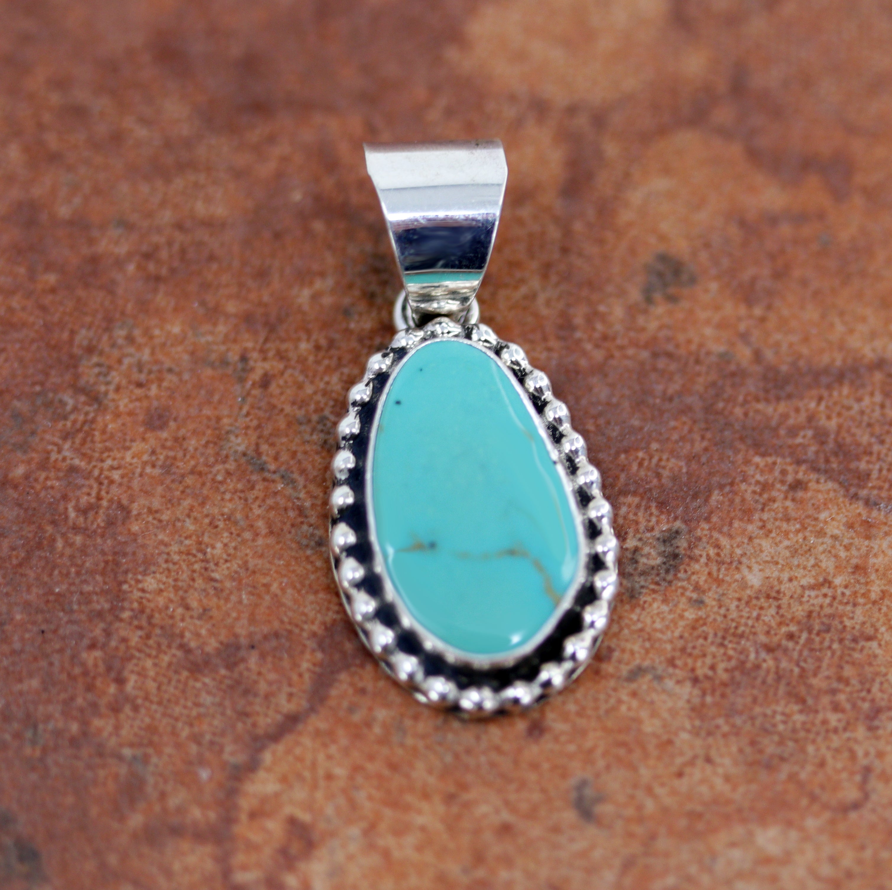 Silver Pendant with round turquoise gemstone 