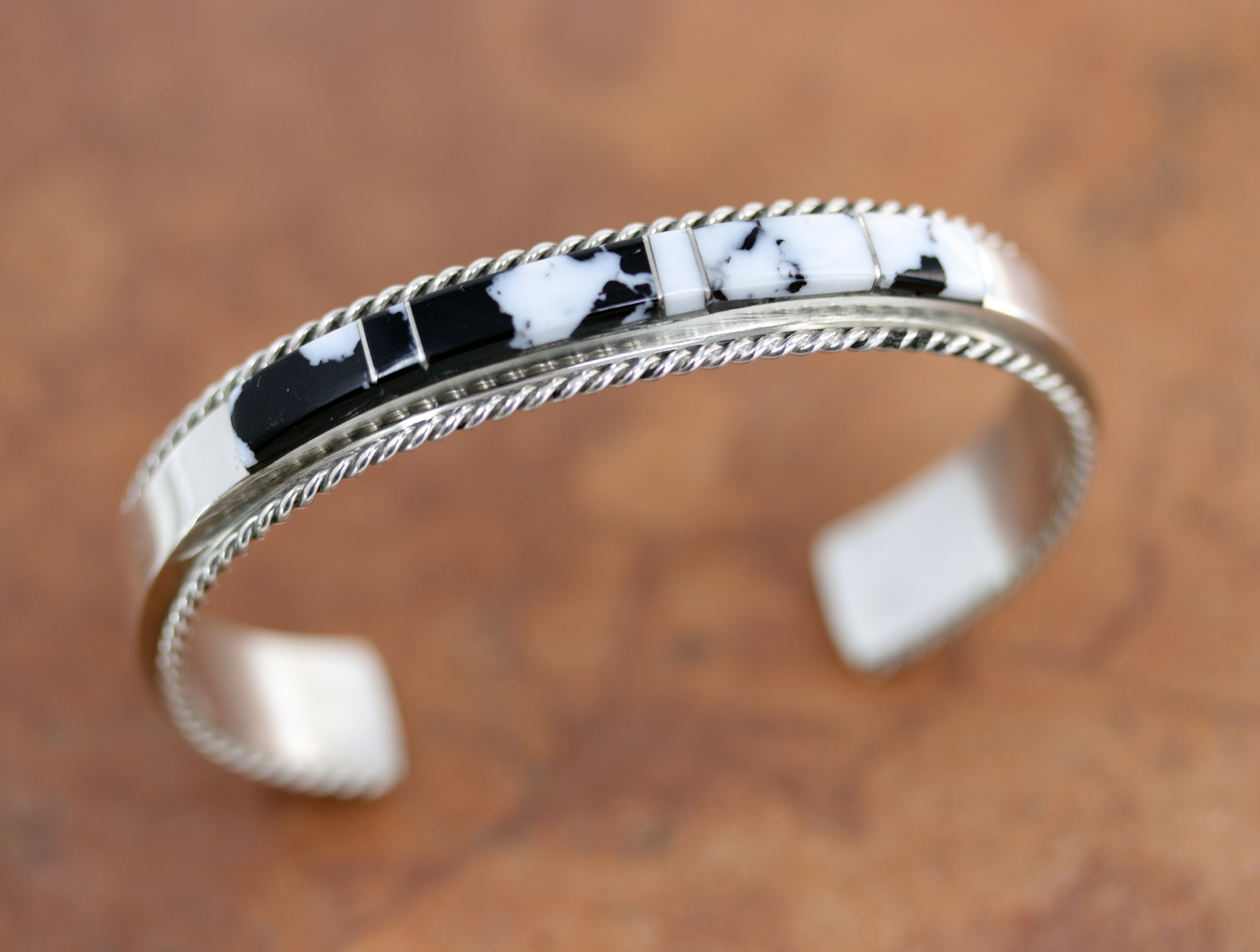 Silver Bracelet with and black stones made from white buffalo