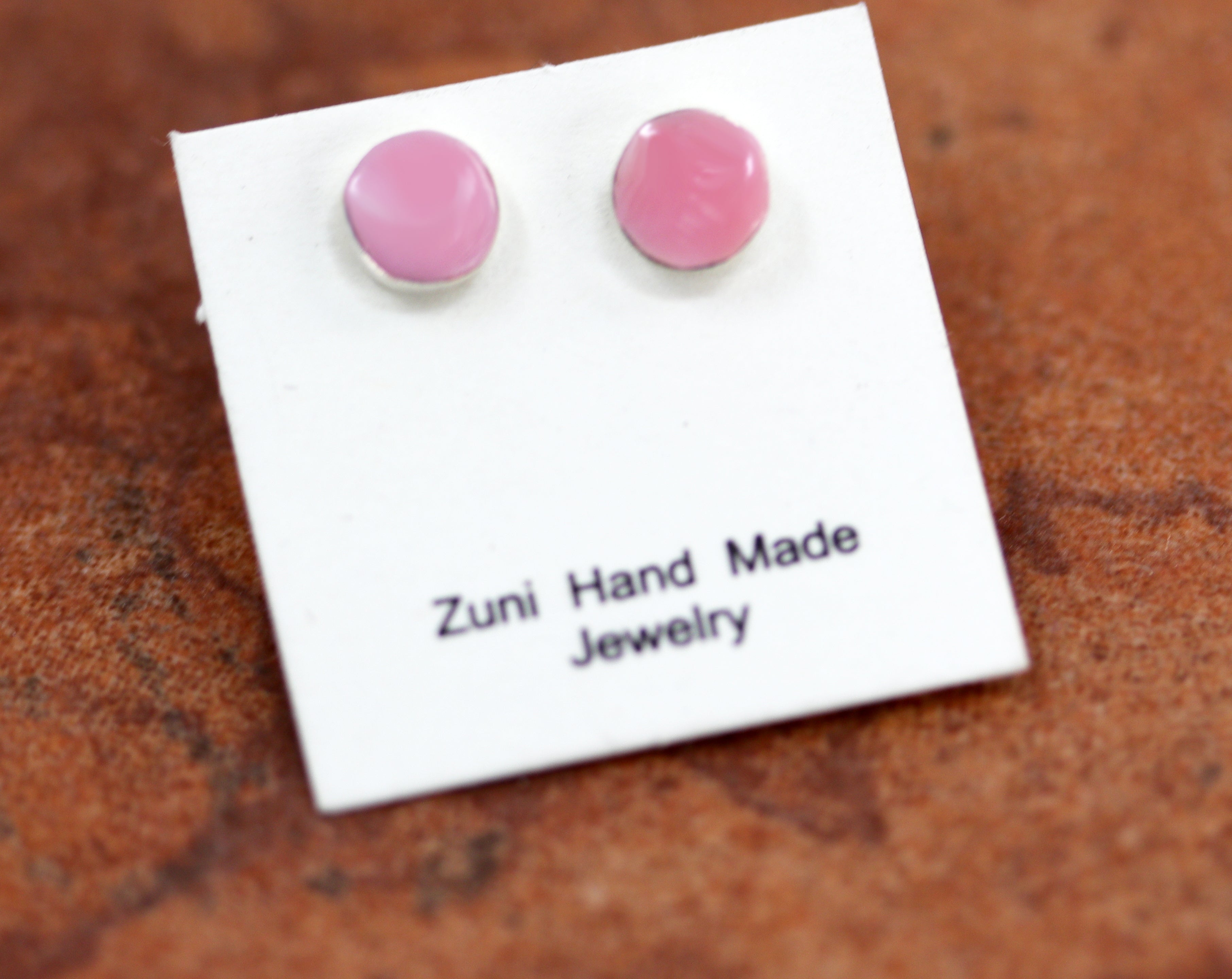 Circular pink earrings with silver earrings